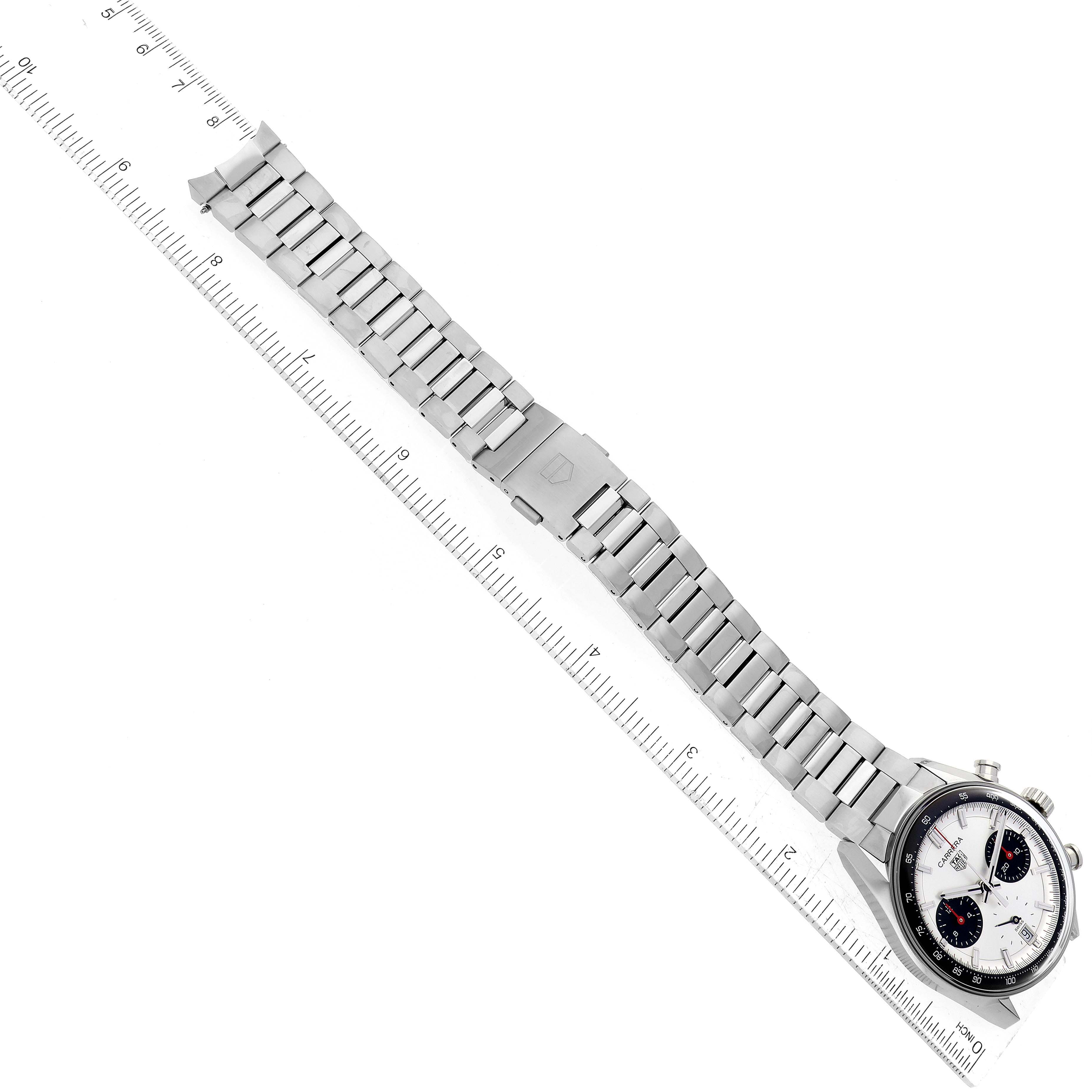 The image shows a top view of a Tag Heuer Carrera CBS2216 Men
s Stainless Steel Silver Dial CBS2216 Men
s Stainless Steel Silver Dial watch, including its stainless steel bracelet and clasp, next to a ruler for scale.
