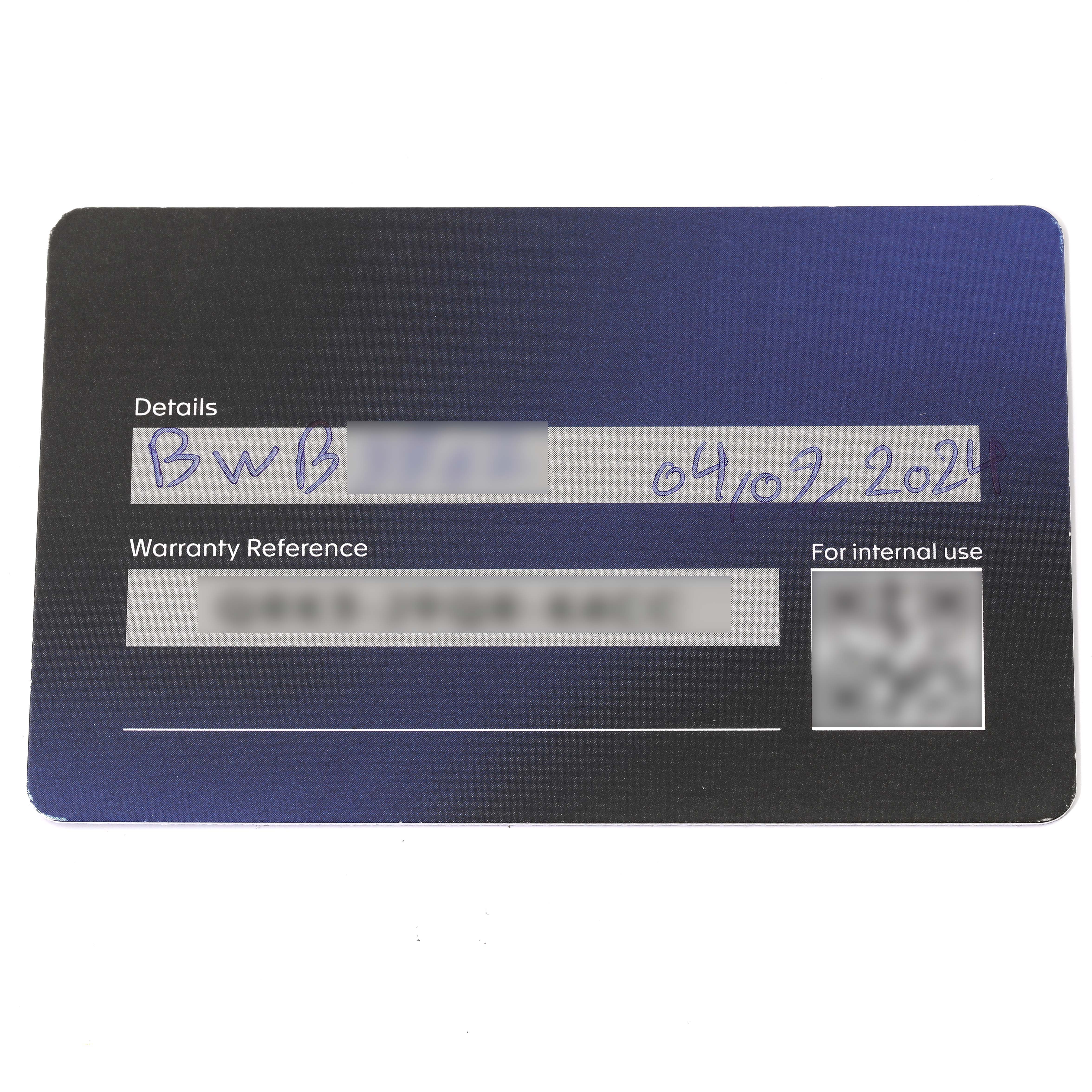 This is a warranty card for the Carrera model by Tag Heuer, showing handwritten details and warranty reference.