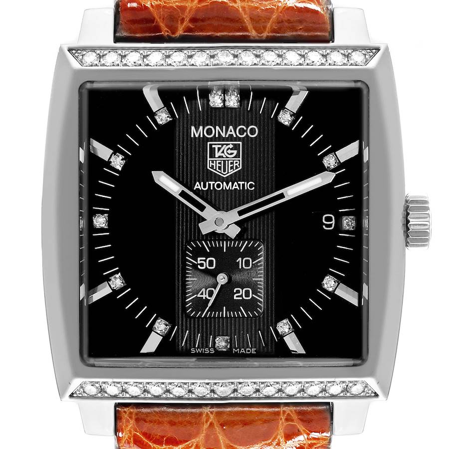 The image shows a front-facing view of the Tag Heuer Monaco watch, highlighting its black dial, diamond accents, and brown strap.