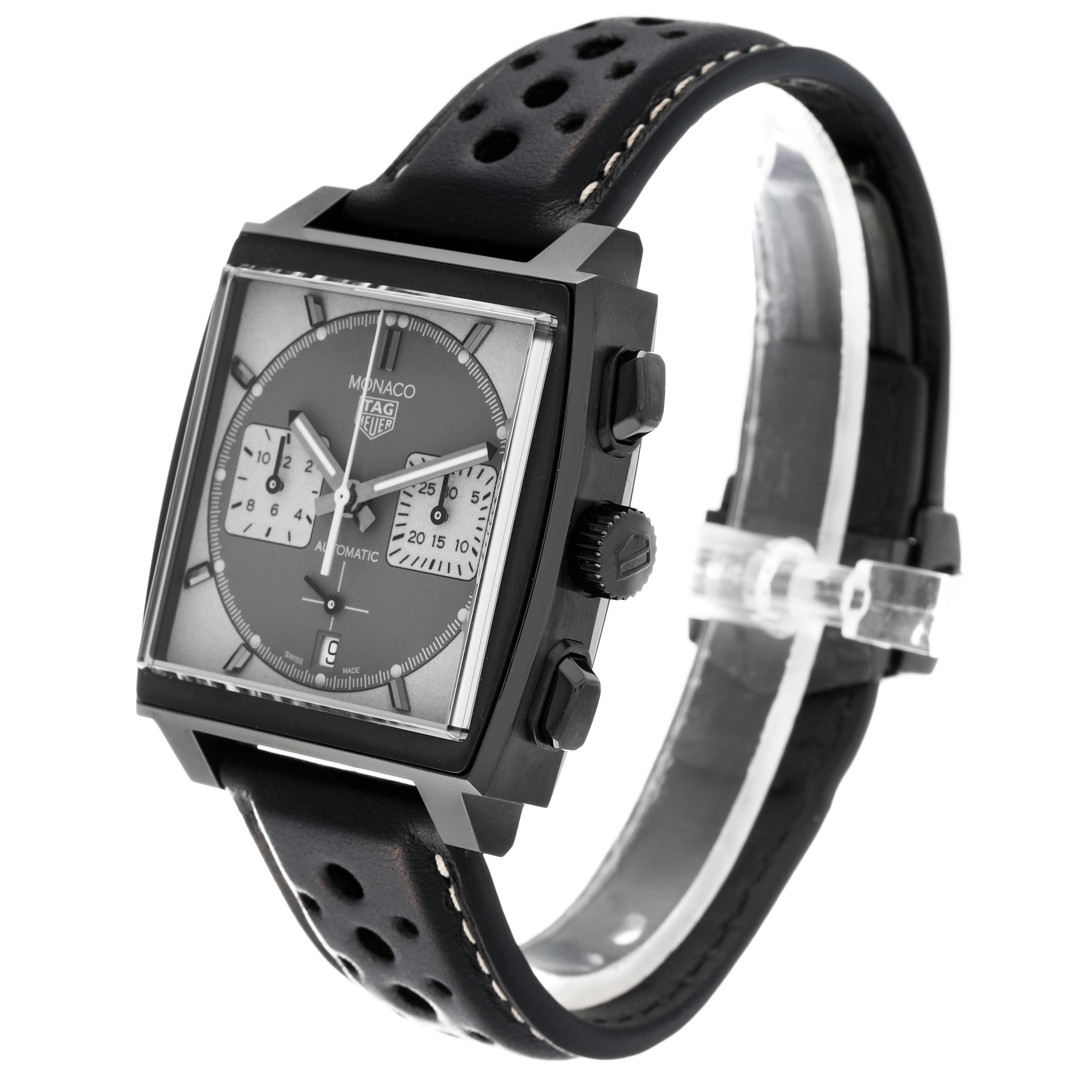 The image shows a Tag Heuer Monaco CBL2181 Men's Titanium Grey Dial CBL2181 Men's Titanium Grey Dial watch with a side view highlighting its square case, black leather strap, and chronograph buttons.