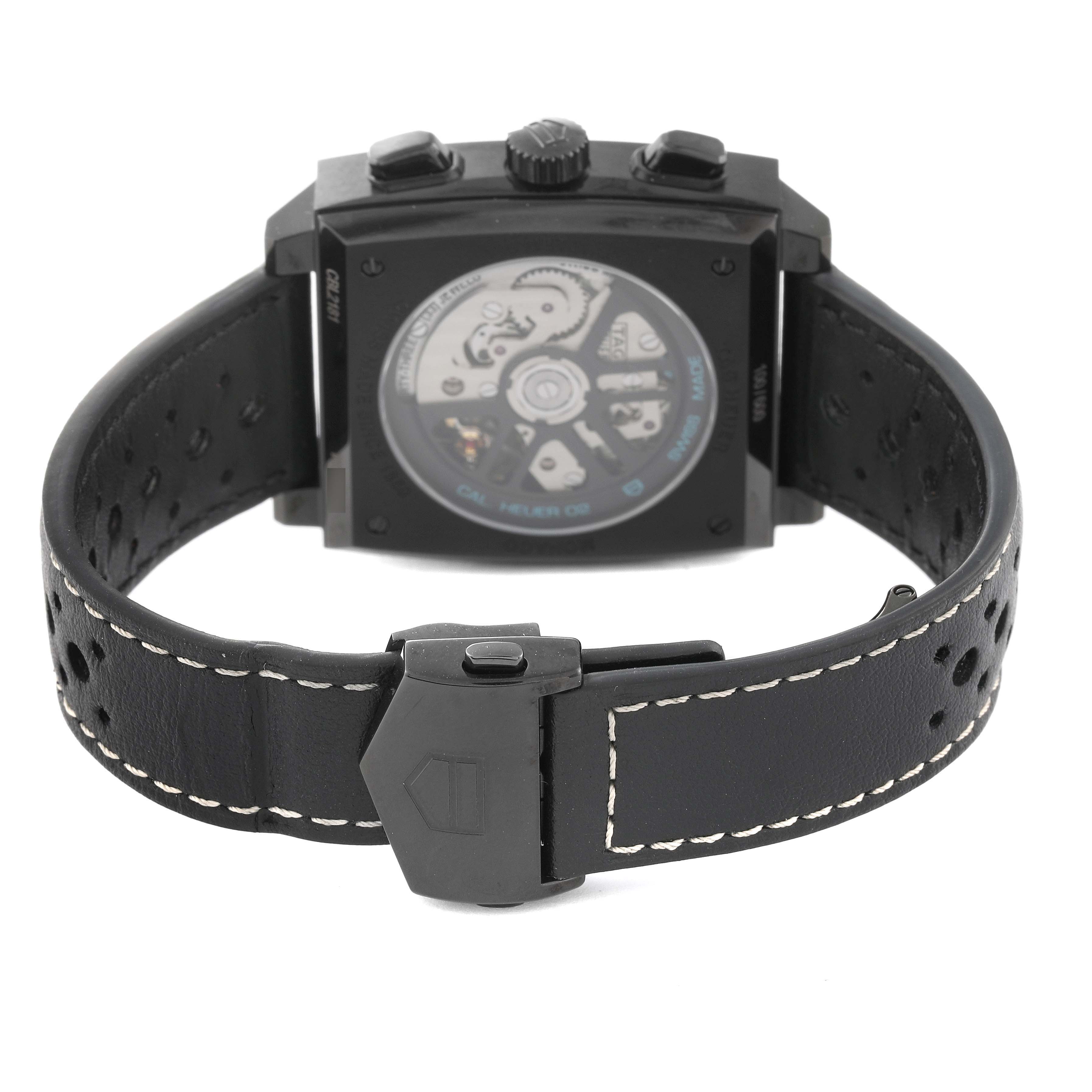 The image shows the back view and clasp of the Tag Heuer Monaco CBL2181 Men's Titanium Grey Dial CBL2181 Men's Titanium Grey Dial watch, highlighting the movement and leather strap.