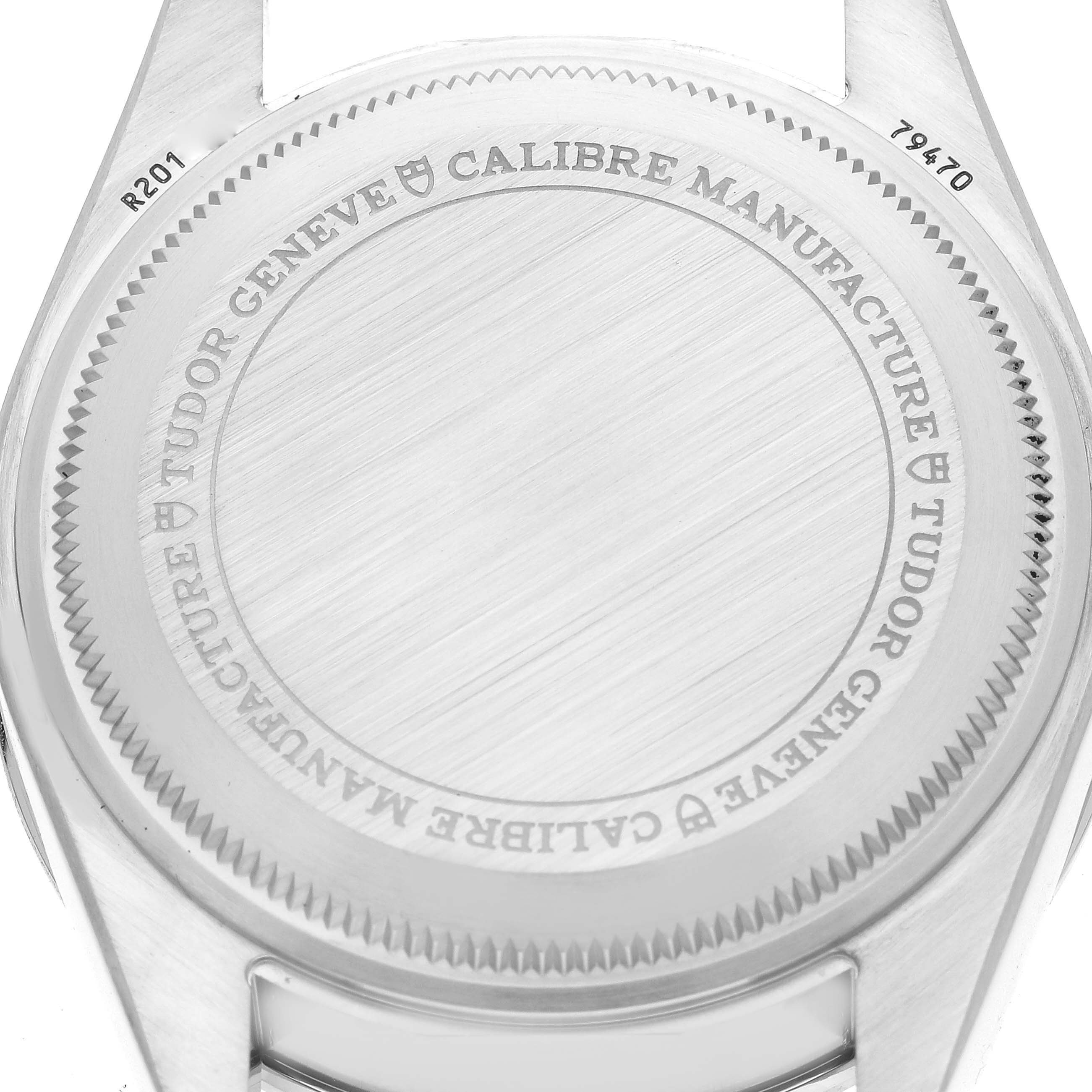 The image shows the back case of the Tudor Heritage Black Bay 79470 Men
s Stainless Steel Black Dial 79470 Men
s Stainless Steel Black Dial watch, with the brand and model details engraved.