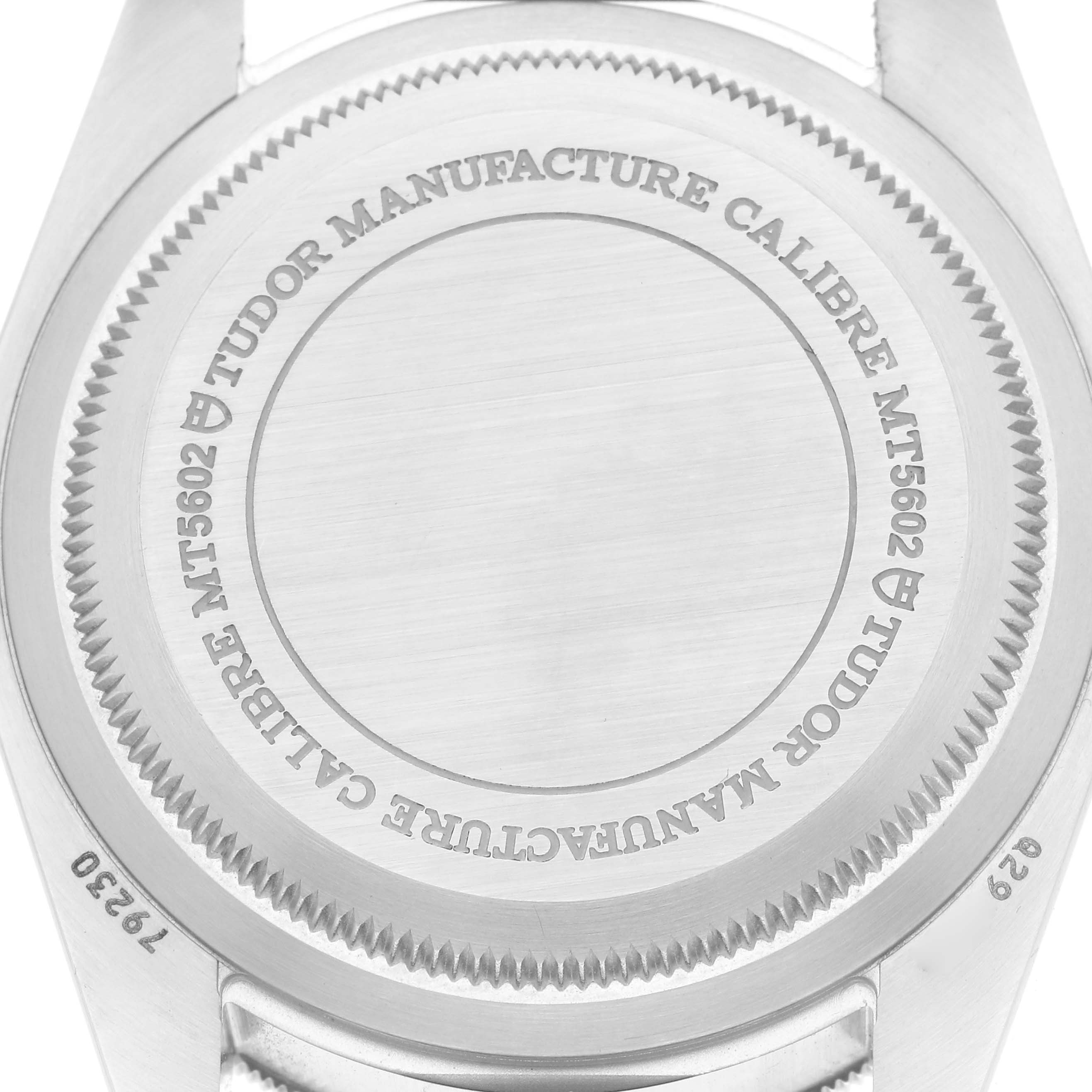 The image shows the back of the Tudor Heritage Black Bay model 79230R men's watch, highlighting the engravings on its case back.