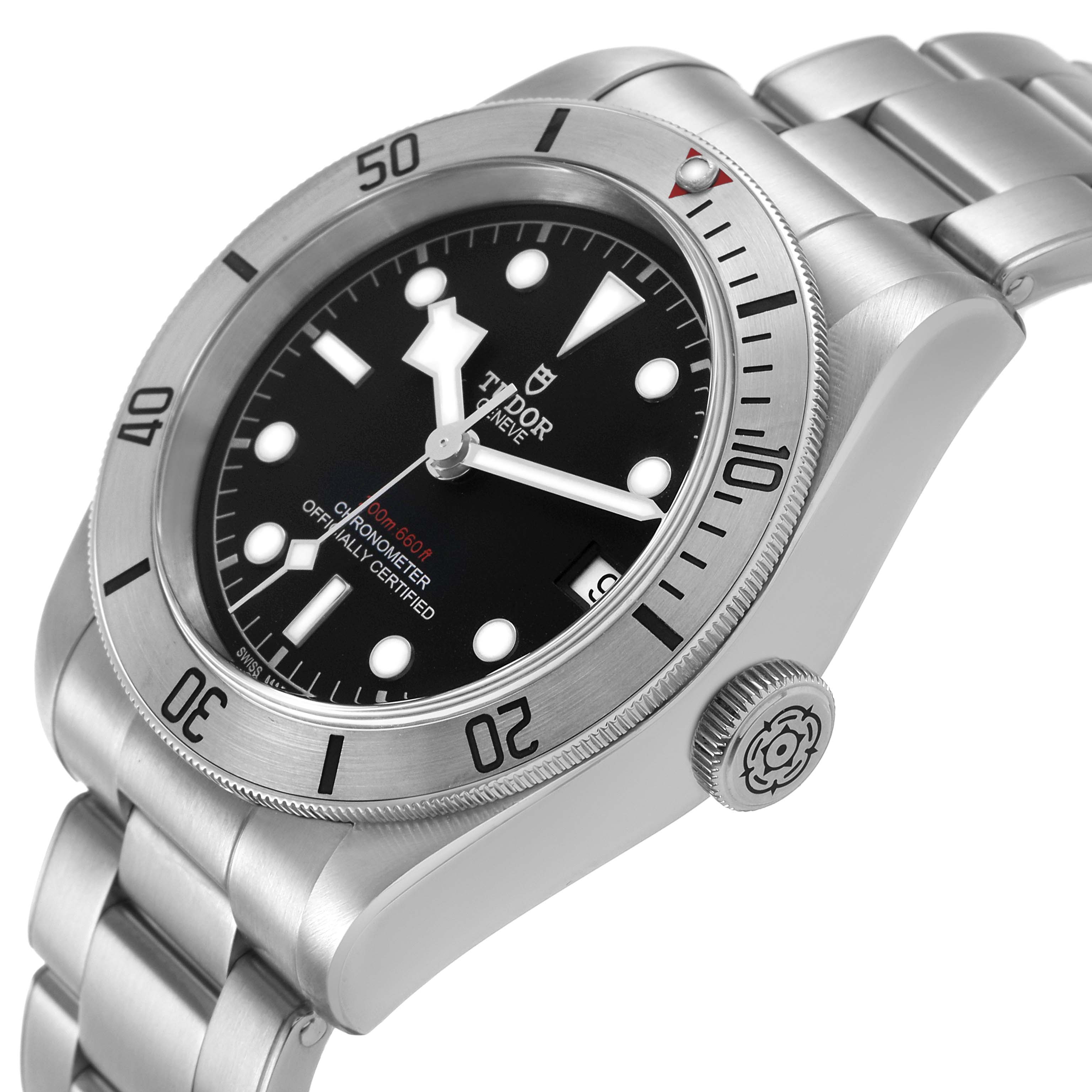 The Tudor Heritage Black Bay M79730-003 Men's Stainless Steel Black Dial watch is shown at a slight side angle, highlighting the dial, bezel, and bracelet.