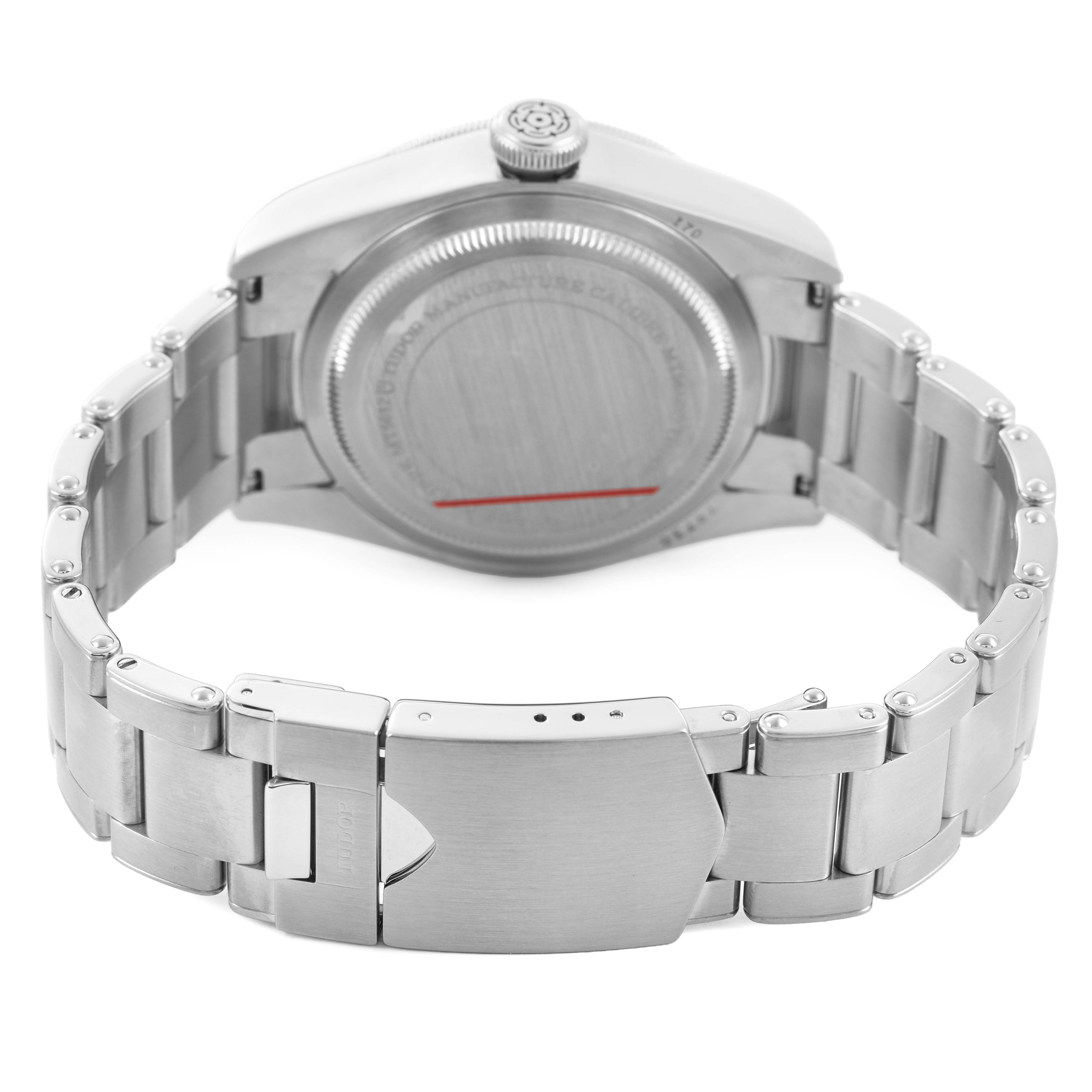 The image shows the back view of a Tudor Heritage Black Bay M79730-003 Men's Stainless Steel Black Dial watch, highlighting its case back and metal bracelet.