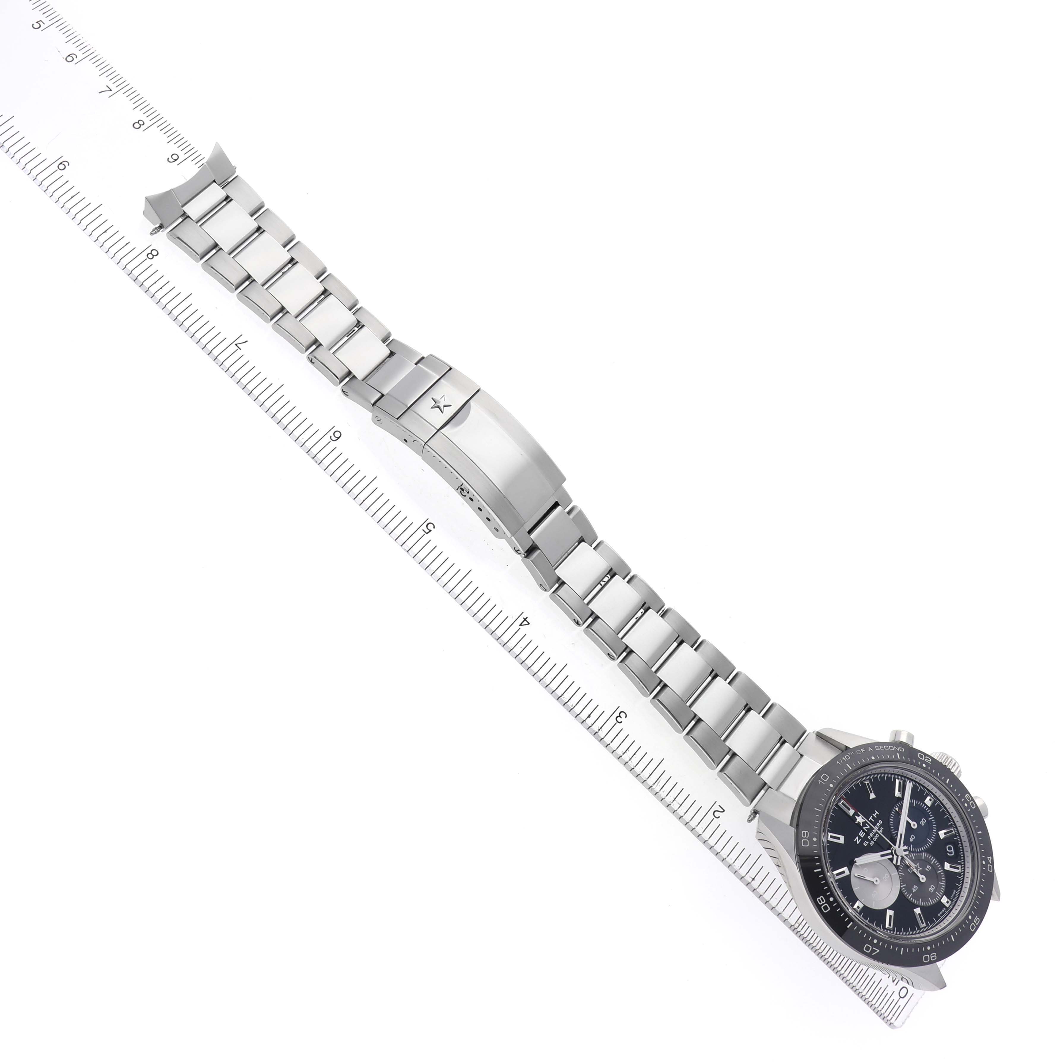 The image shows the Zenith Chronomaster model 03.3100.3600/21.M3100 watch laid flat, showcasing its bracelet and clasp from a top-down angle.