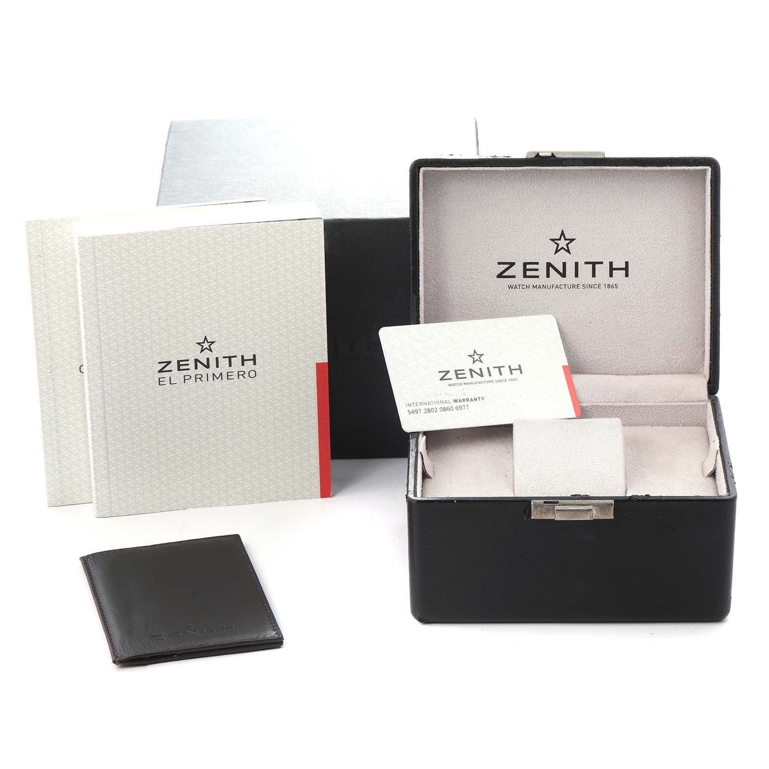 The image shows the packaging and accessories for a Zenith Chronomaster model 03.2080.400/21.C496 men's watch, including a box, manuals, and warranty card.