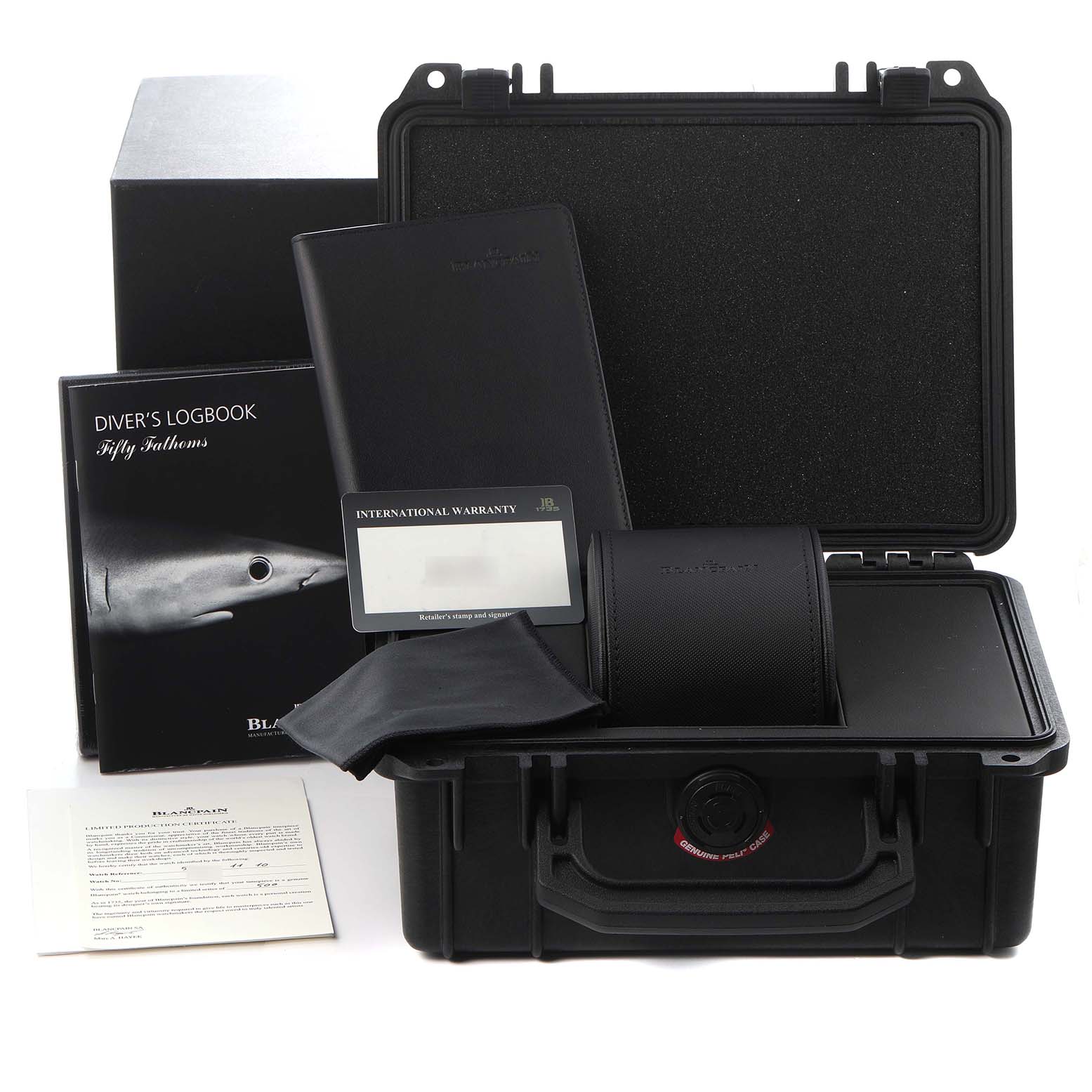 The image shows a Blancpain Fifty Fathoms model 5052-1110-63A with its accessories, including a diver's logbook, warranty card, case, and additional documentation.