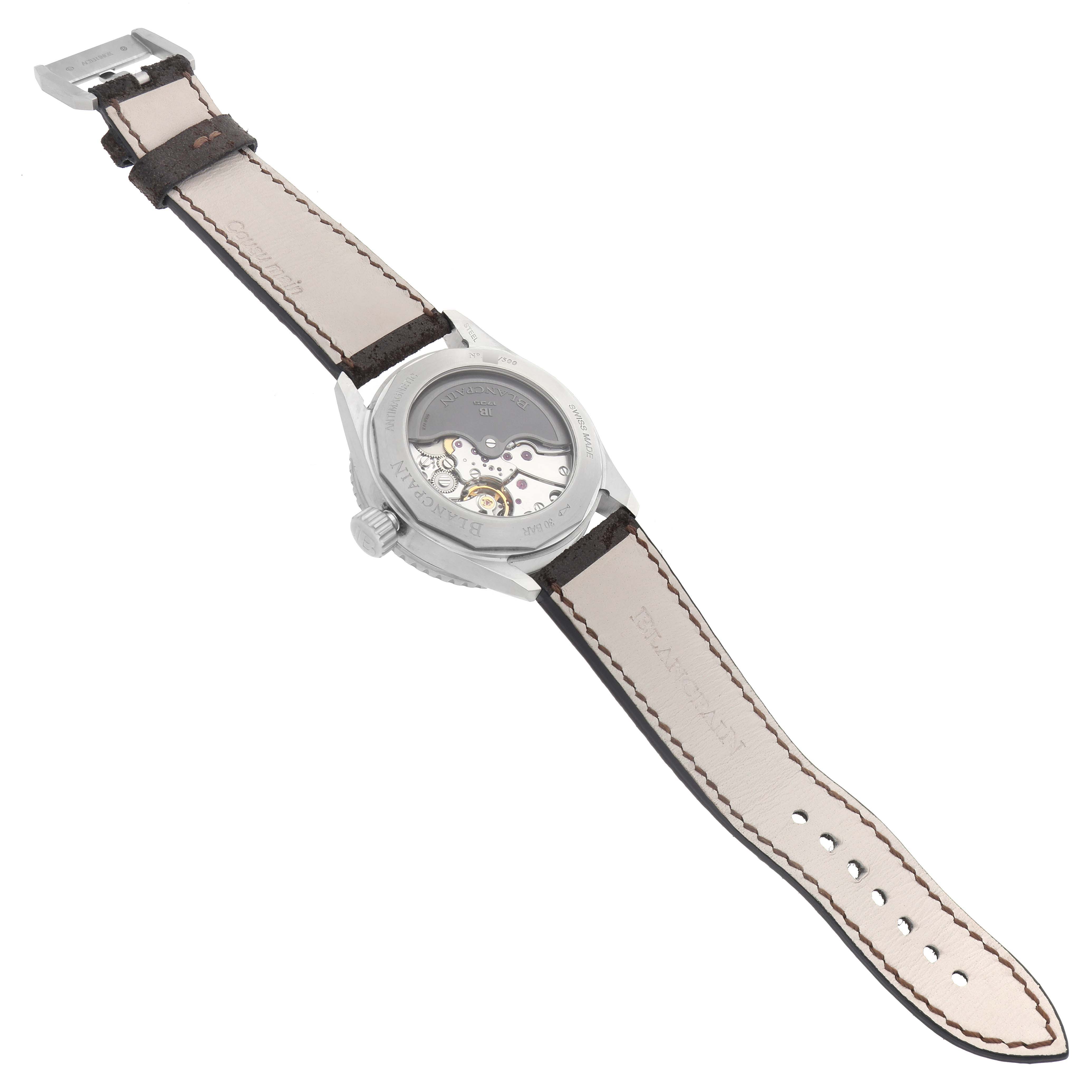 The image shows the back view of the Blancpain Fifty Fathoms model 5052-1110-63A, highlighting its movement and open leather strap.