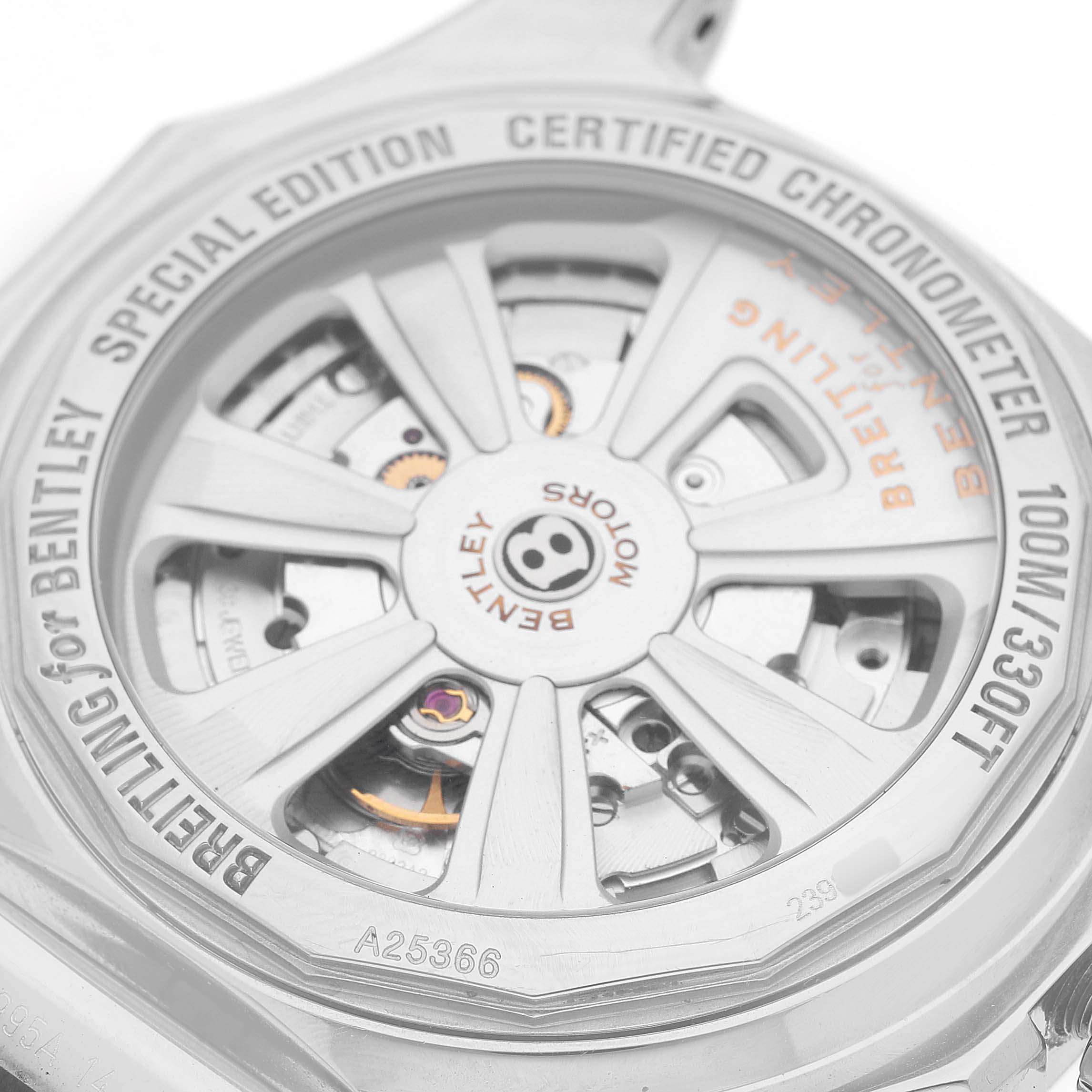 The image shows the back view of a Breitling Bentley A25366 / A259G32FL Men's Stainless Steel Silver Dial watch, highlighting its rotor and mechanical movement with engravings.