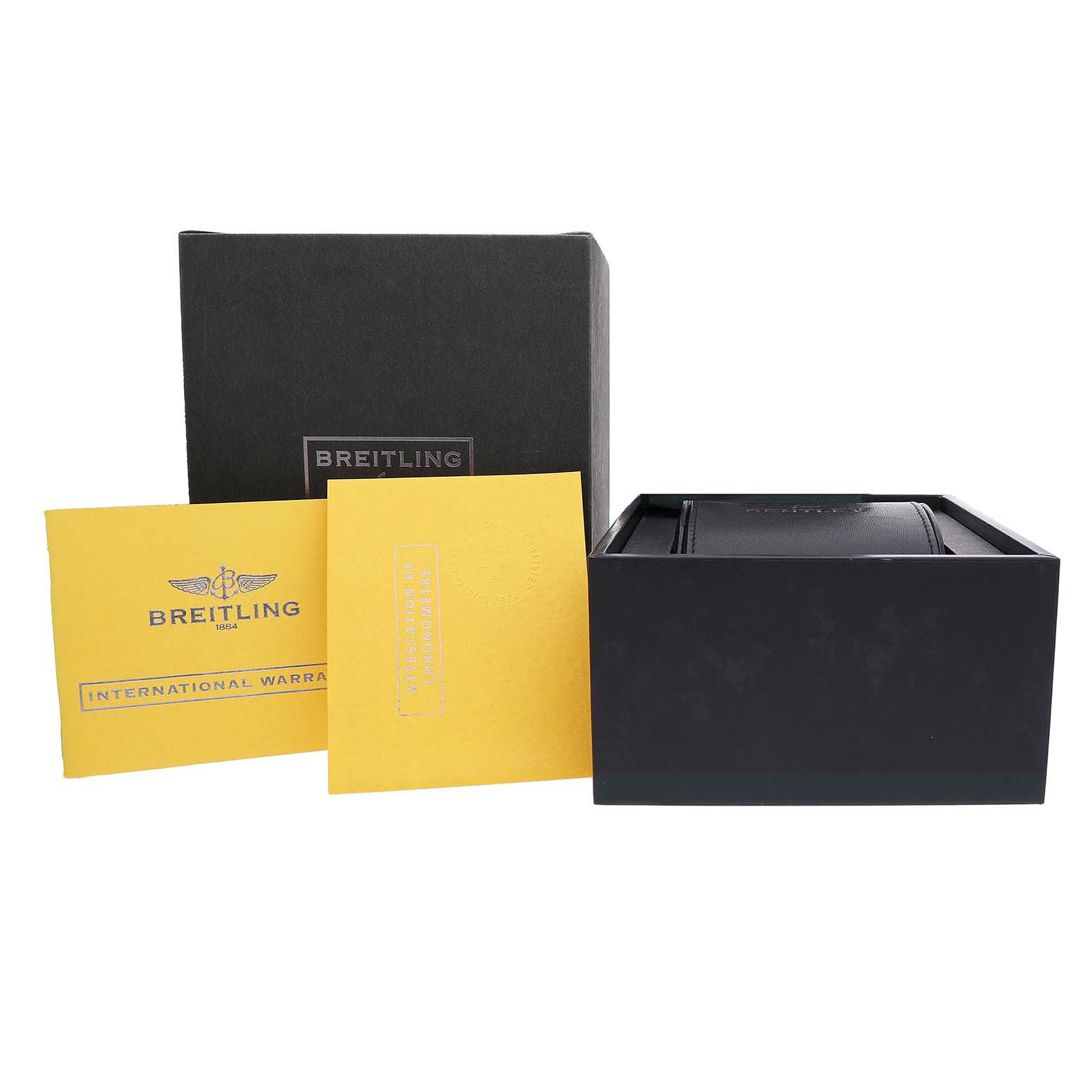 The image shows the packaging and documentation for the Bentley model by Breitling, including a black box and warranty cards.