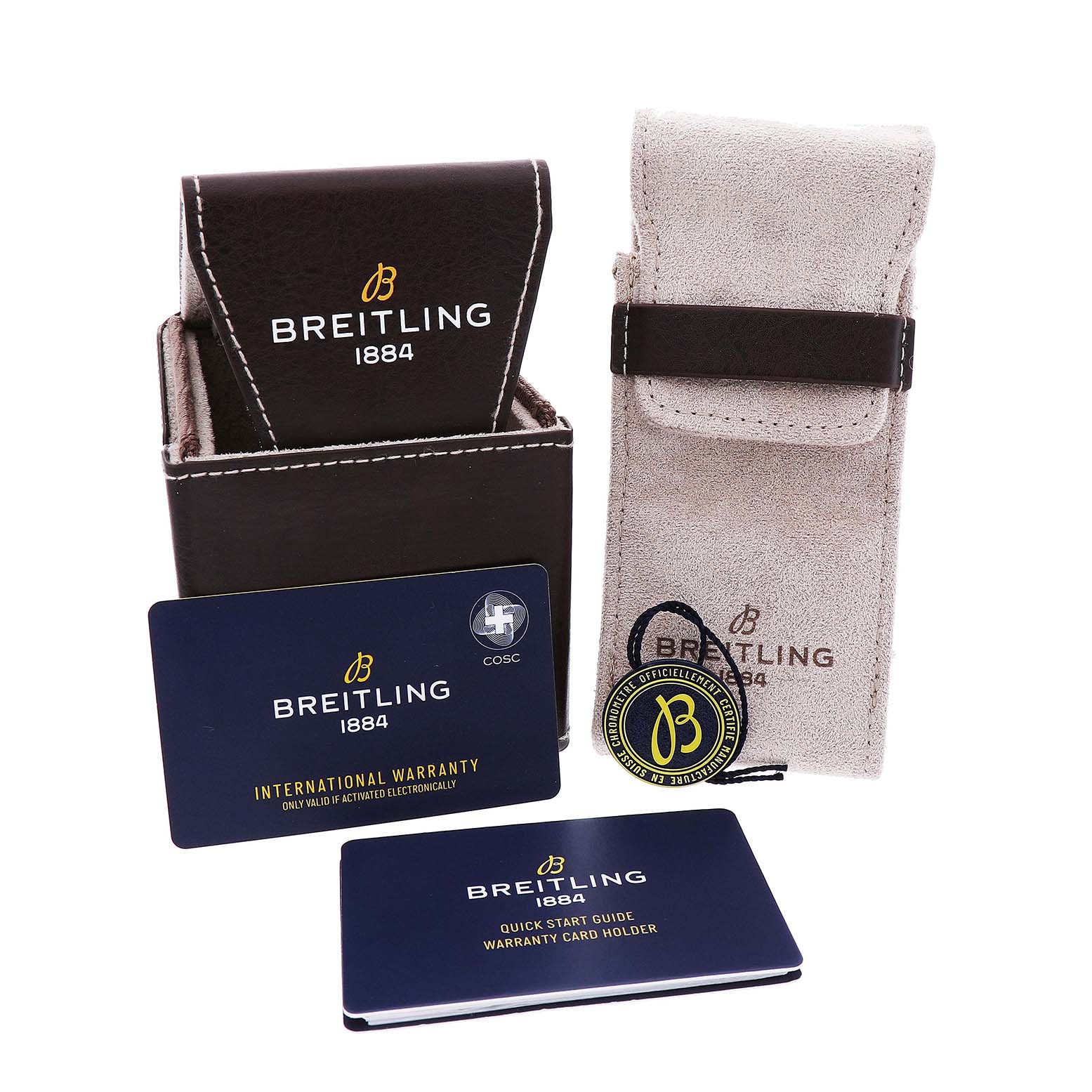 The image shows a Breitling Chronomat AB0134 Men's Stainless Steel Blue Dial watch's packaging, including a brown box, beige pouch, warranty card, and guide from a front angle.