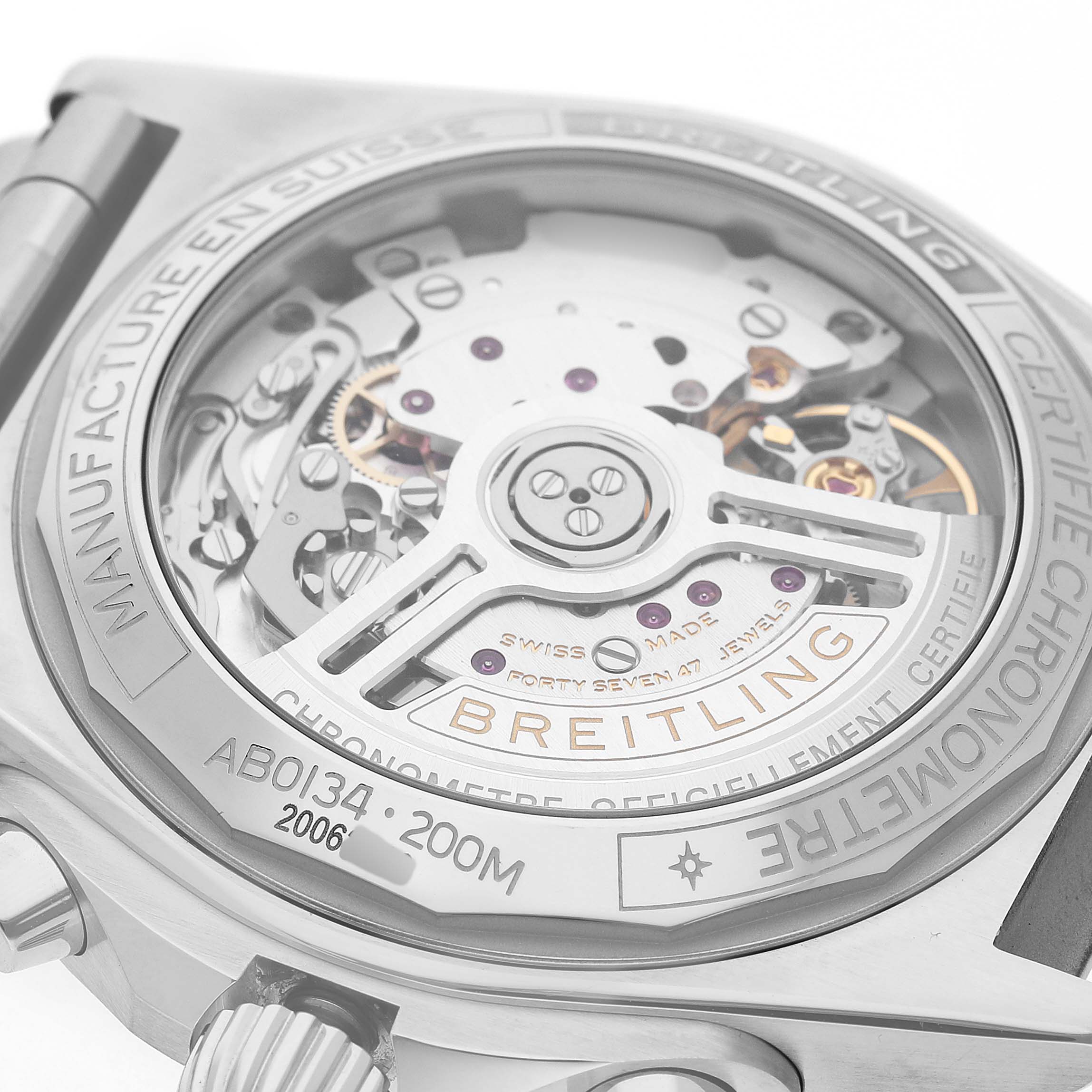 The image shows the back view of the Breitling Chronomat AB0134 Men's Stainless Steel Blue Dial, highlighting its movement and engraved details.