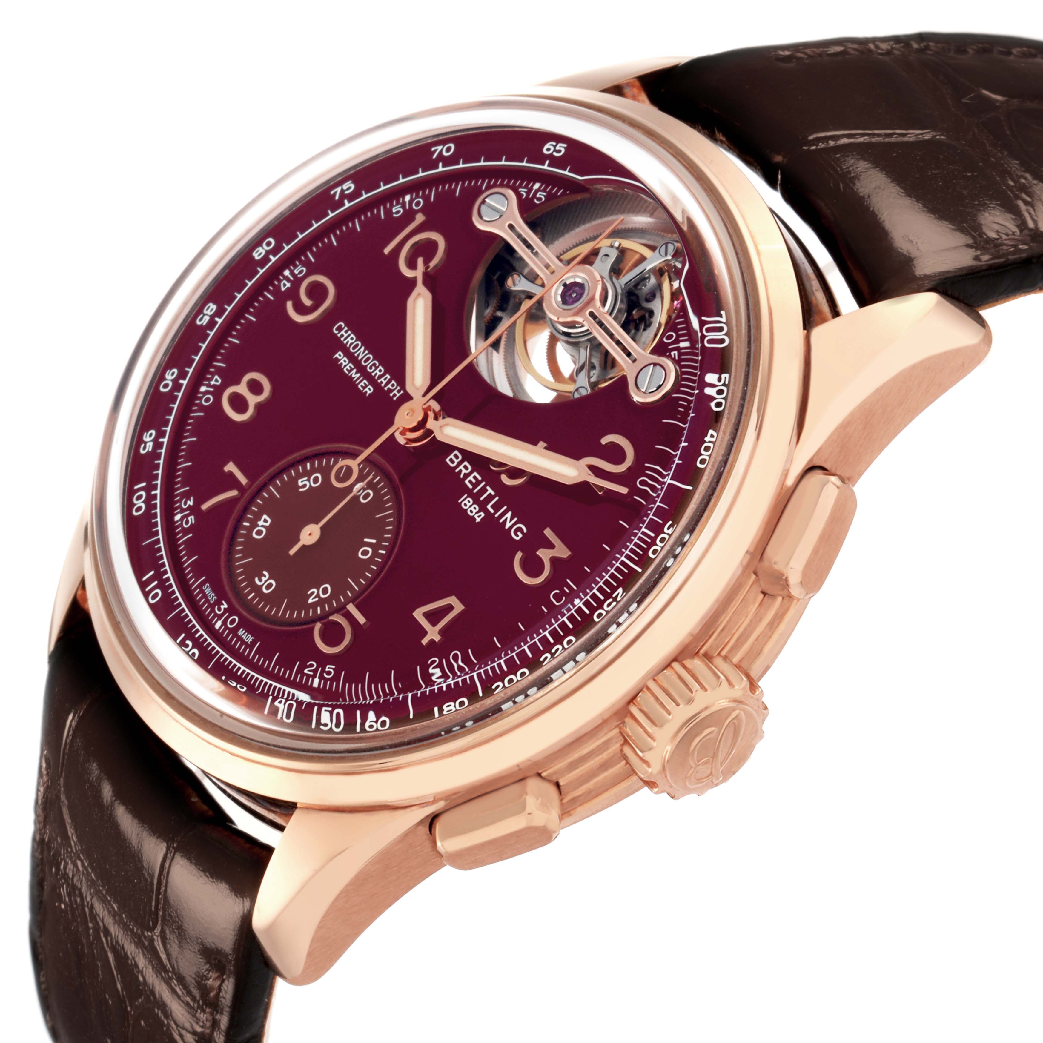 The Breitling Premier RB21202A1K1P1 watch is shown at an angle, highlighting the dial, crown, chronograph features, and leather strap.