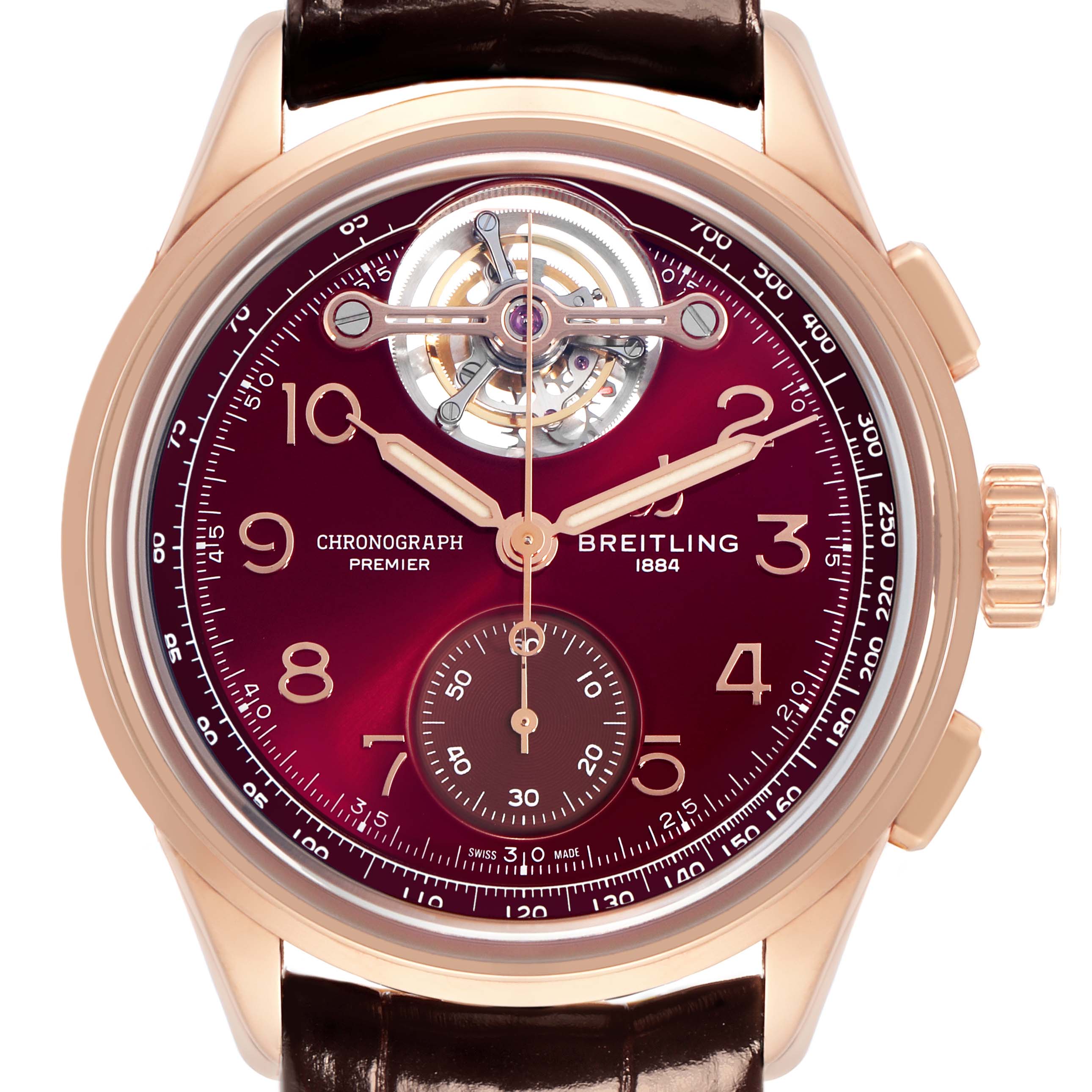 The image shows a frontal view of the Breitling Premier model RB21202A1K1P1 men's watch, highlighting its burgundy dial, chronograph sub-dial, and open heart feature.