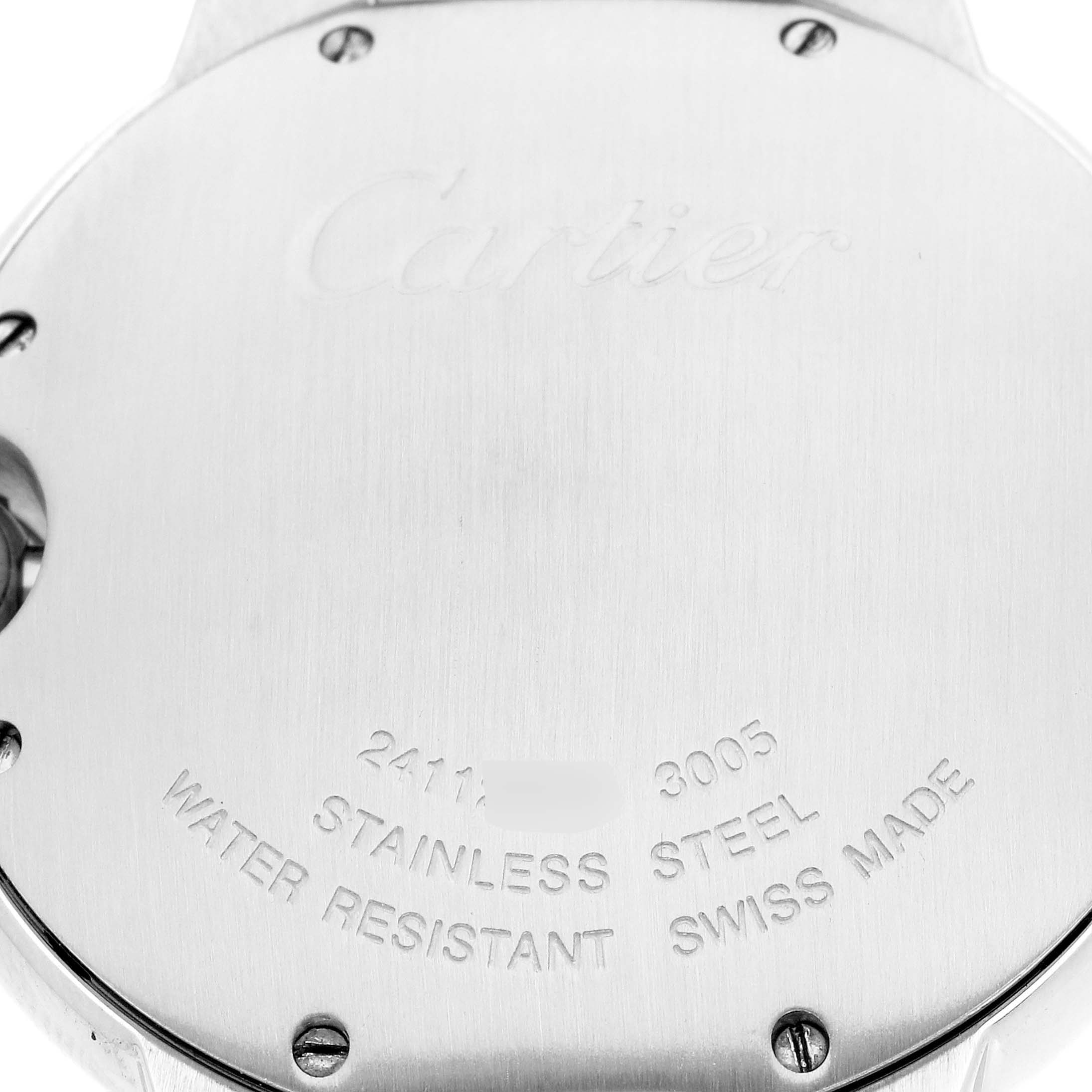 The image shows the back of the Cartier Ballon Bleu men's watch, model W69011Z4, highlighting the engraved brand name and specifications like "Stainless Steel" and "Swiss Made."