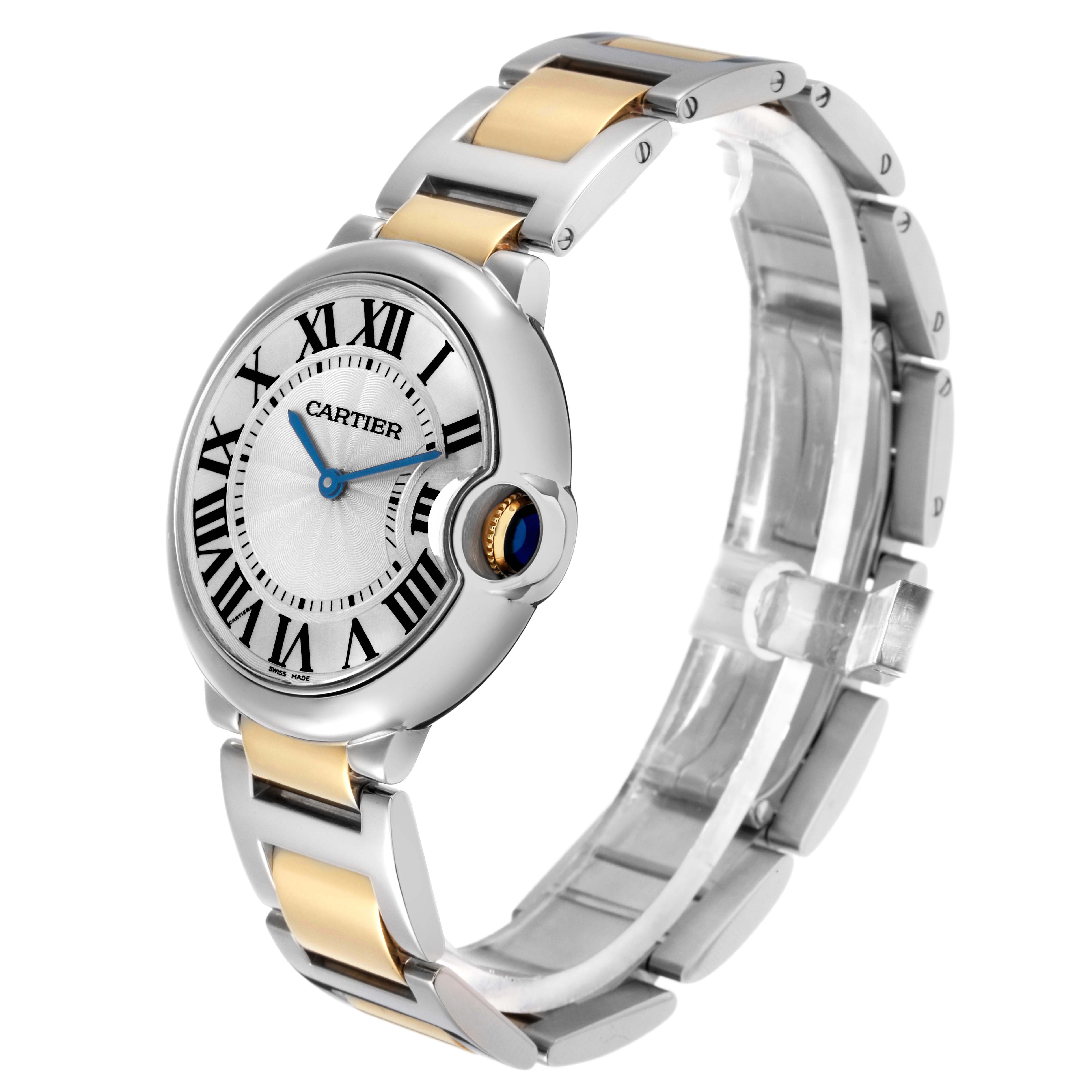 The image shows a Cartier Ballon Bleu model W69008Z3 men's watch at a slight angle, highlighting the face, roman numerals, blue hands, and metal bracelet.