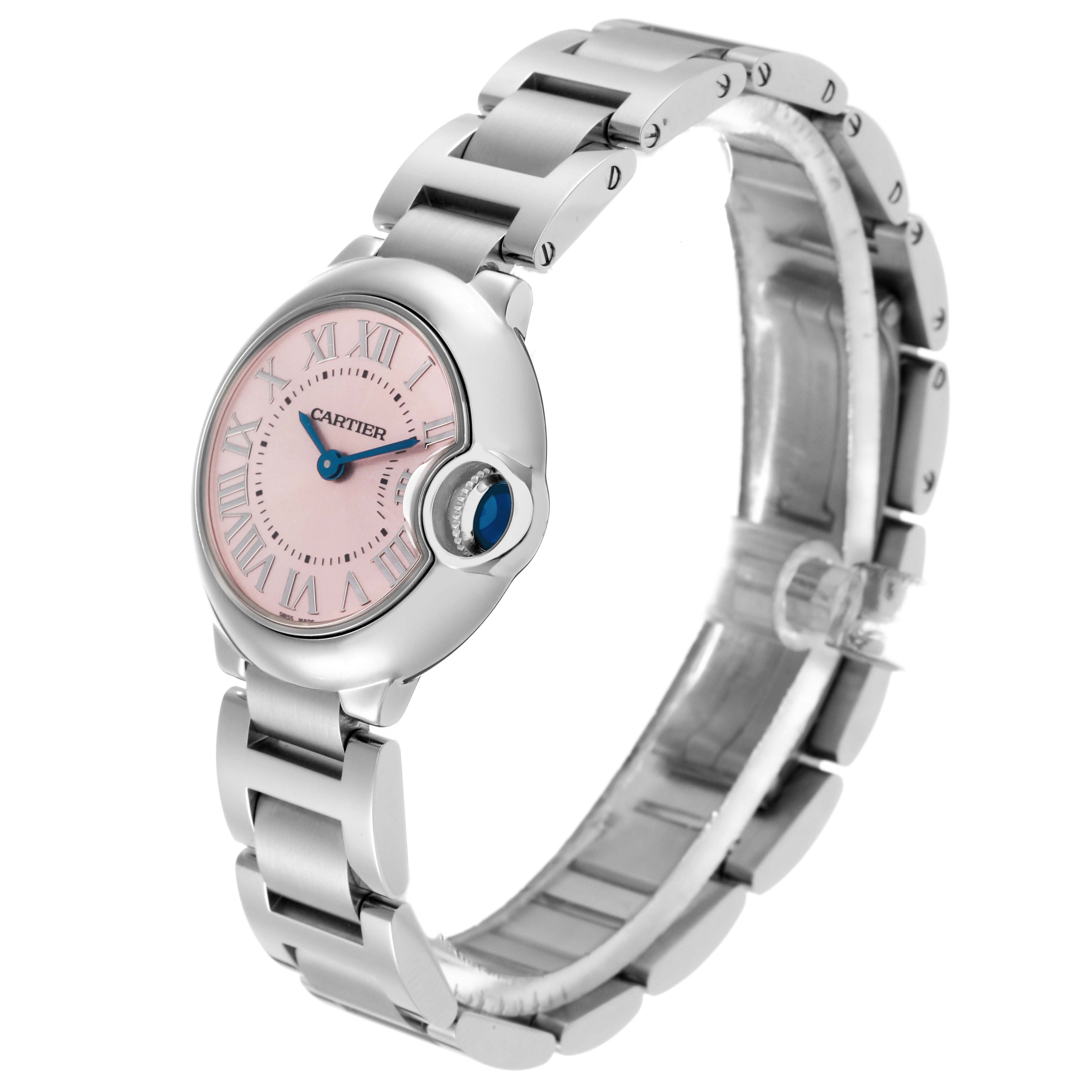 The image shows a Cartier Ballon Bleu model W6920038 watch at a three-quarter angle, highlighting its pink dial, blue accent crown, and steel bracelet.