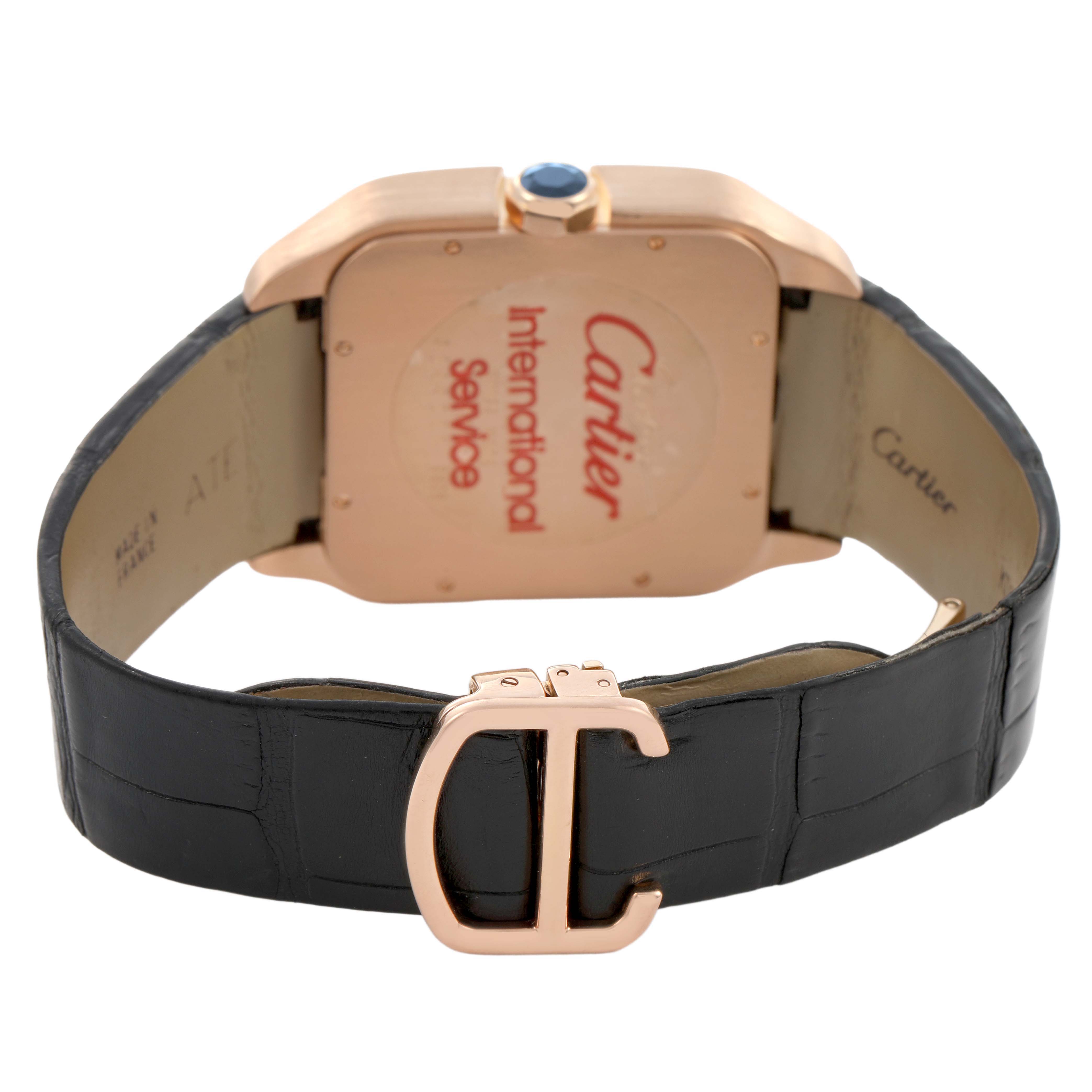 The image shows the back of the Cartier Santos Dumont W2020068 Men's Rose Gold Grey Dial watch, focusing on the caseback, crown, and leather strap with a "C" buckle.