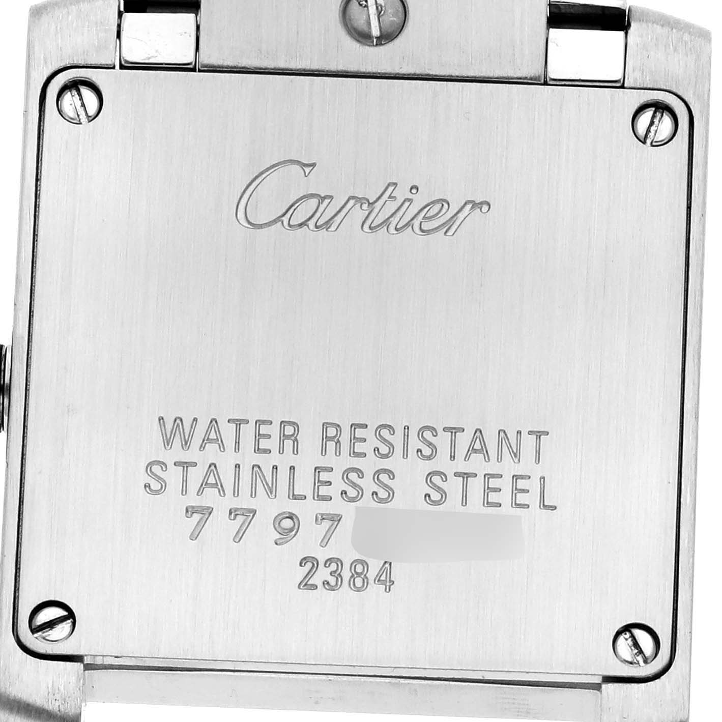 The image shows the back case of the Cartier Tank Francaise model W51008Q3, displaying engravings about water resistance and material.