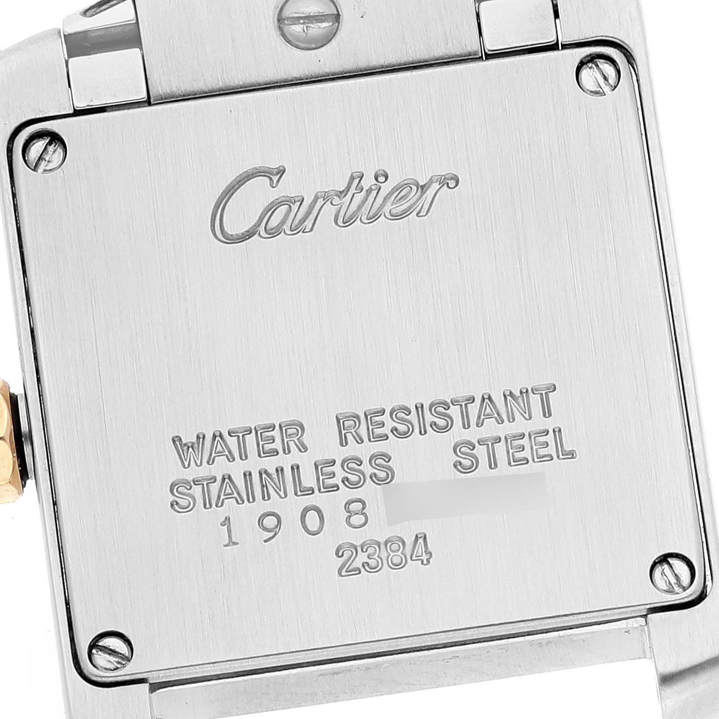 The image shows the caseback of a Tank Française model by Cartier, with engravings indicating water resistance and material.