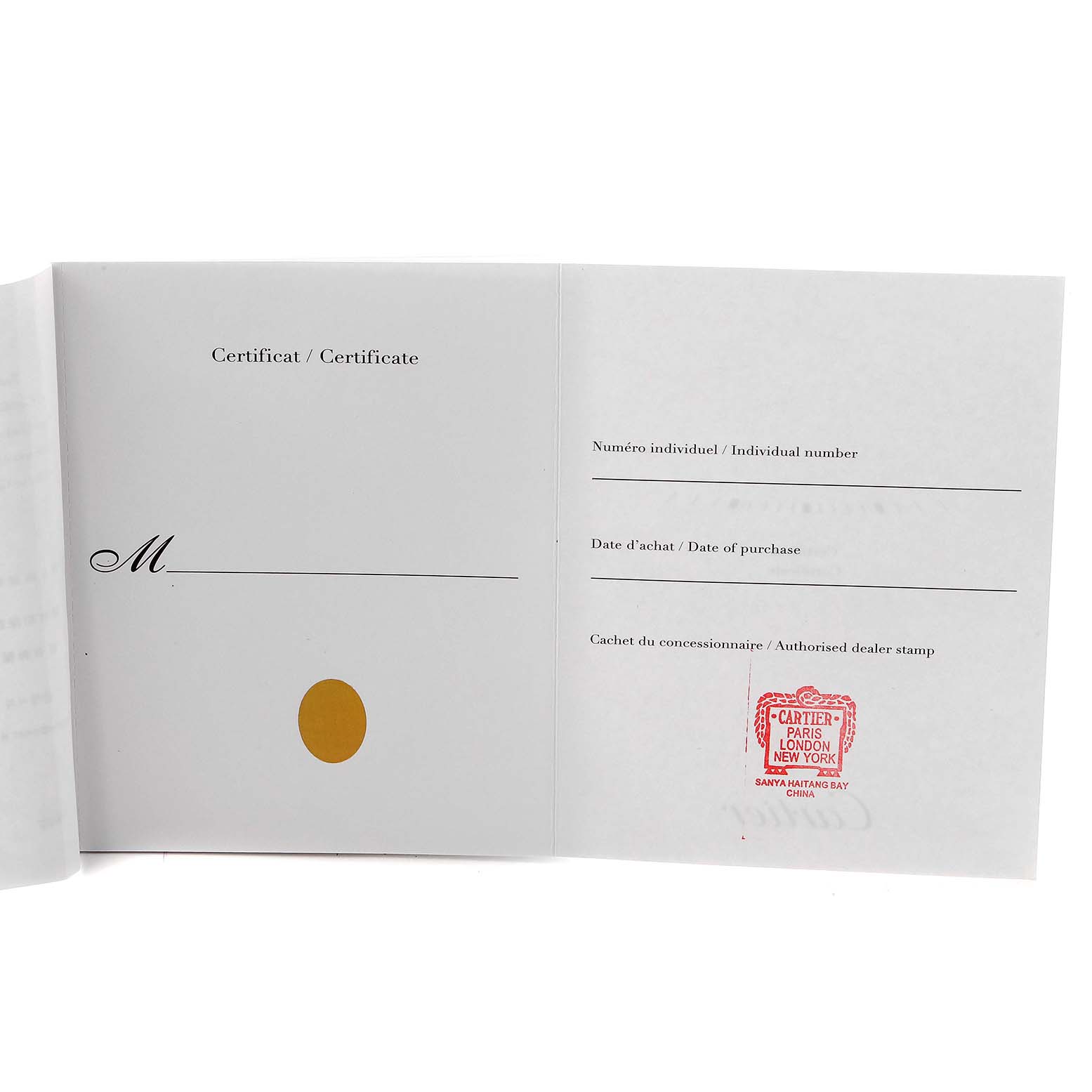 The image shows an open warranty certificate booklet for the Cartier Tank Solo model, model number W5200002, featuring a dealer stamp.