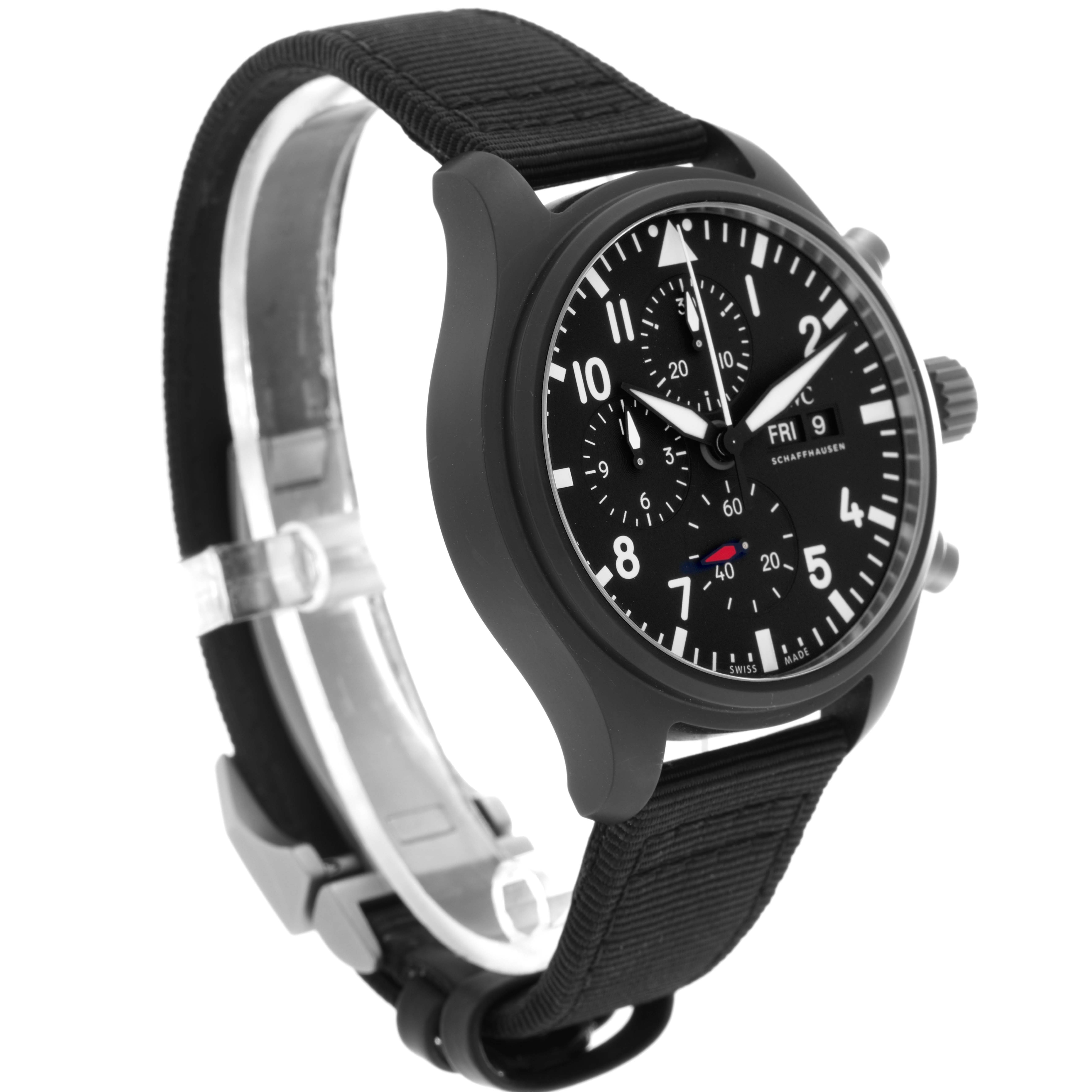 The IWC Pilot model IW389101 watch is shown at a slight angle, highlighting the black dial, chronograph subdials, and black strap.