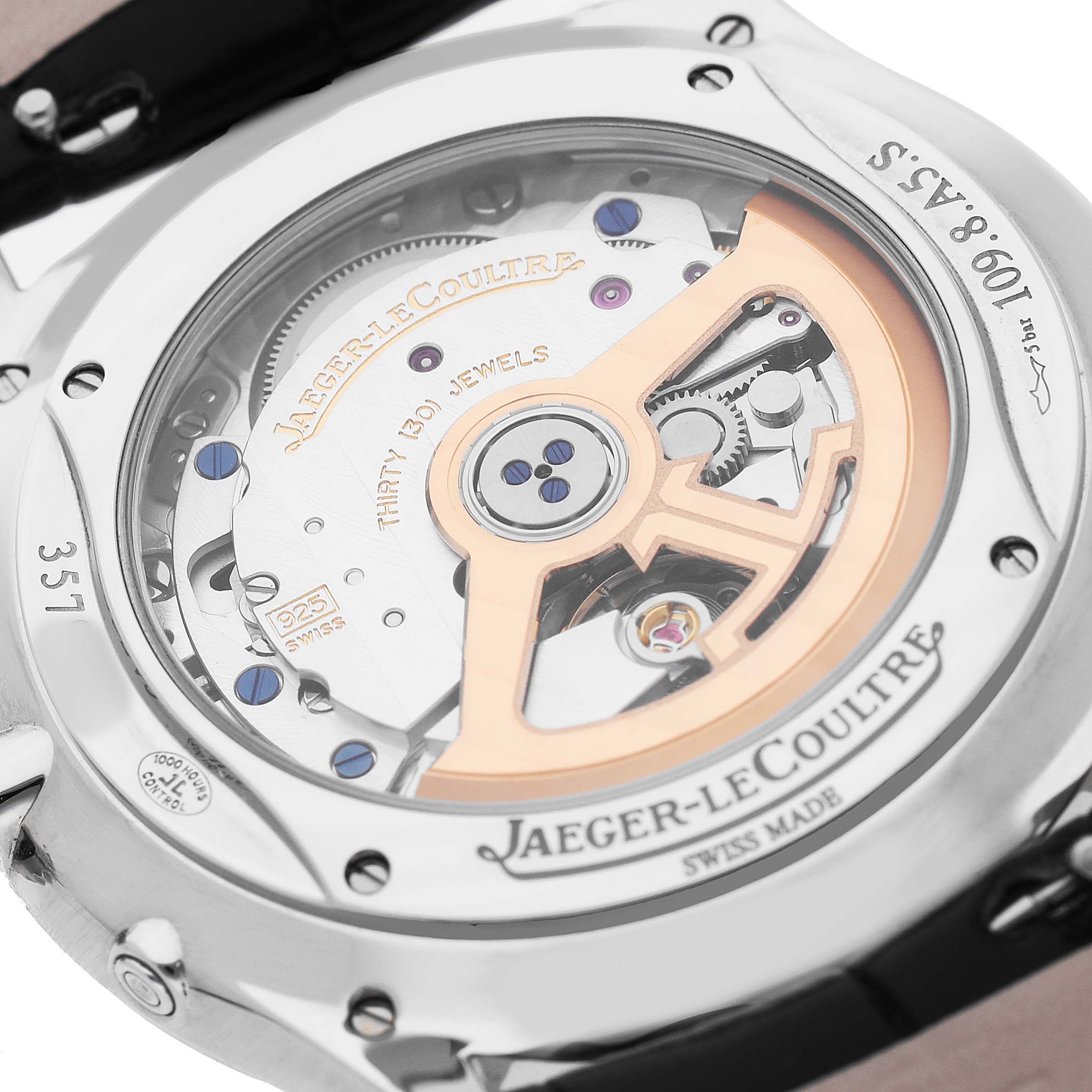 The image shows the back of a Jaeger LeCoultre Master Q1368471 Men's Stainless Steel Black Dial watch, displaying its movement through a transparent case back.