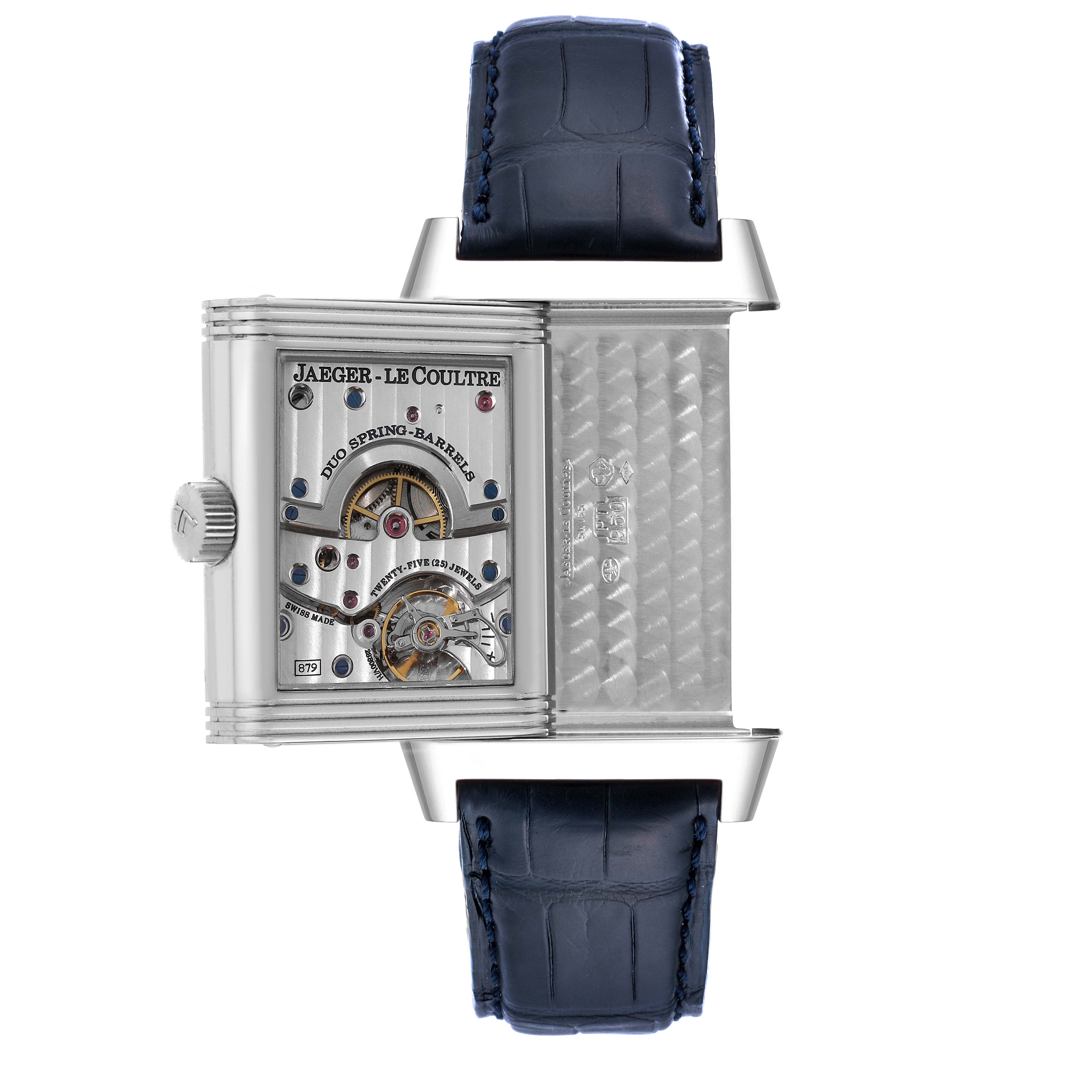 This image shows the open case back and mechanical movement of a Jaeger-LeCoultre Reverso watch with a view of its dual spring barrels and intricate details.