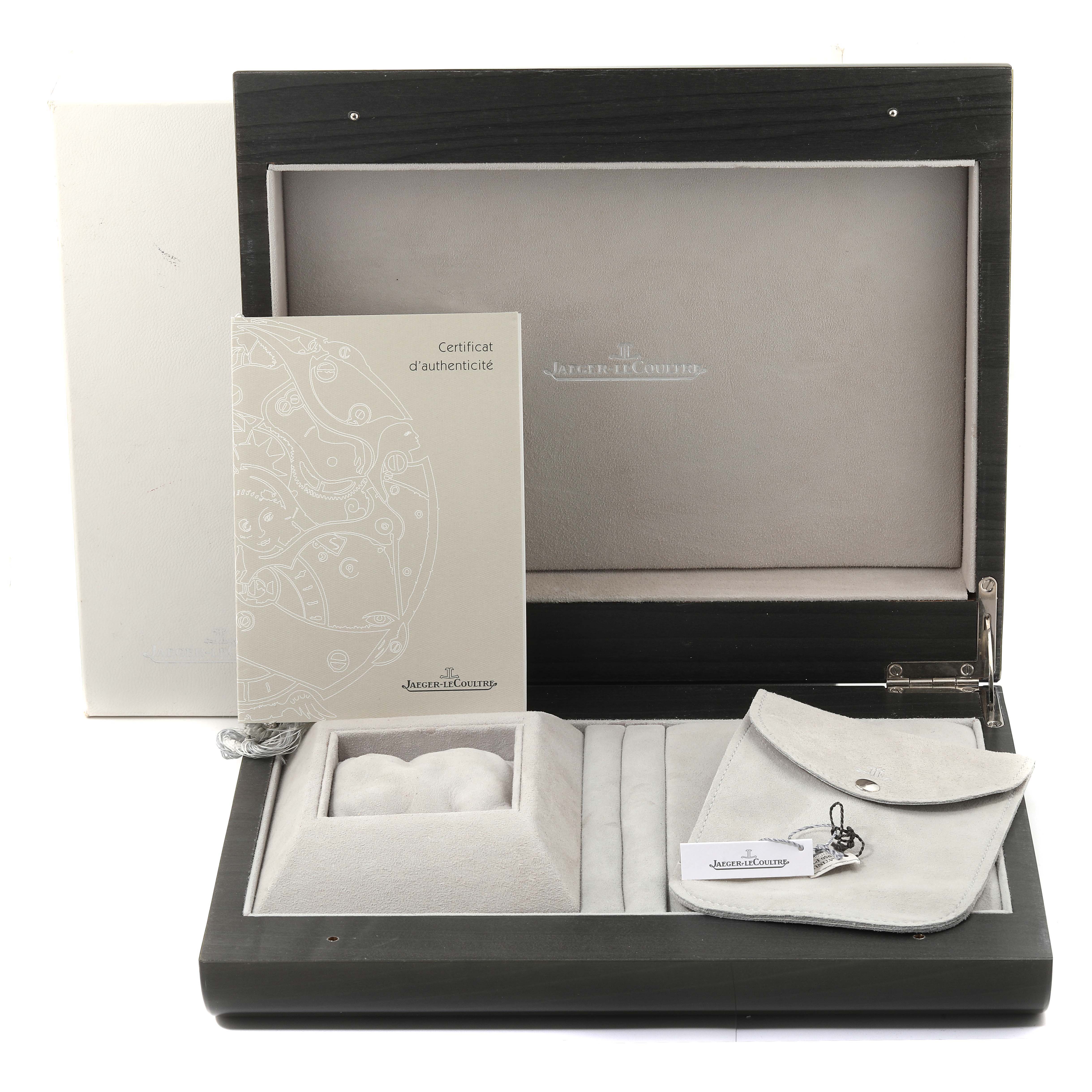 This image shows the open box of a Jaeger LeCoultre Reverso 240.6.19 Men's Platinum Silver Dial 240.6.19 Men's Platinum Silver Dial watch, along with a certificate of authenticity and a small pouch.
