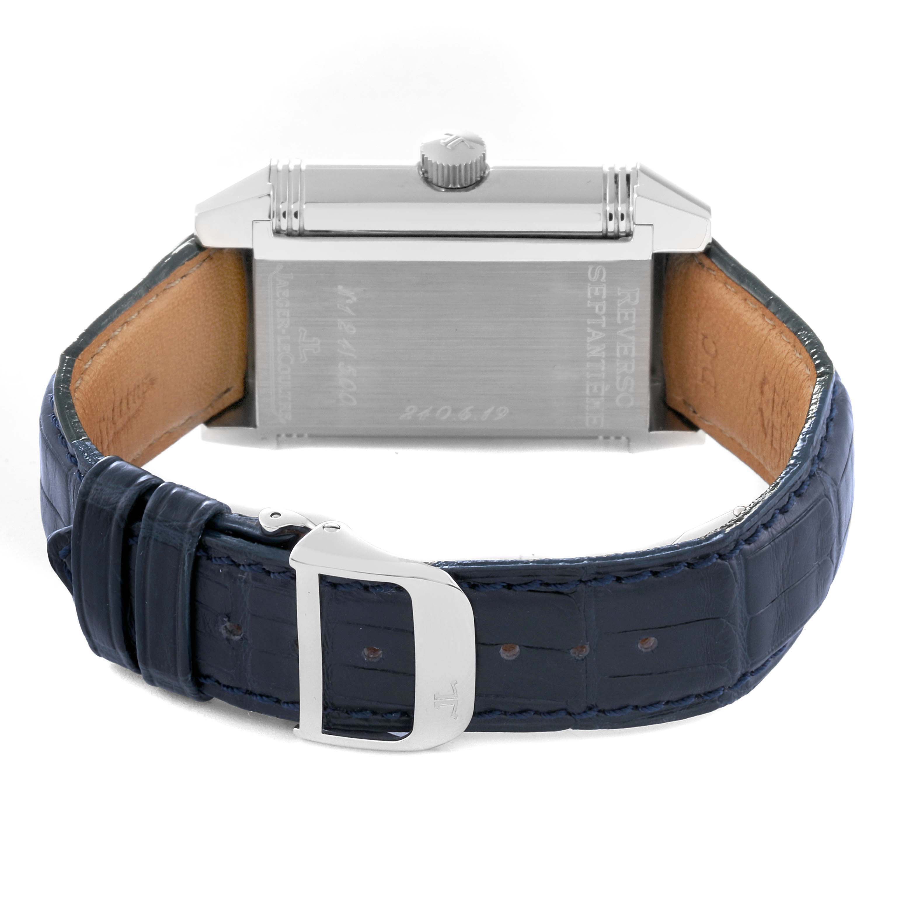 The image shows the back view of a Jaeger-LeCoultre Reverso watch, highlighting the caseback and the leather strap with its clasp.