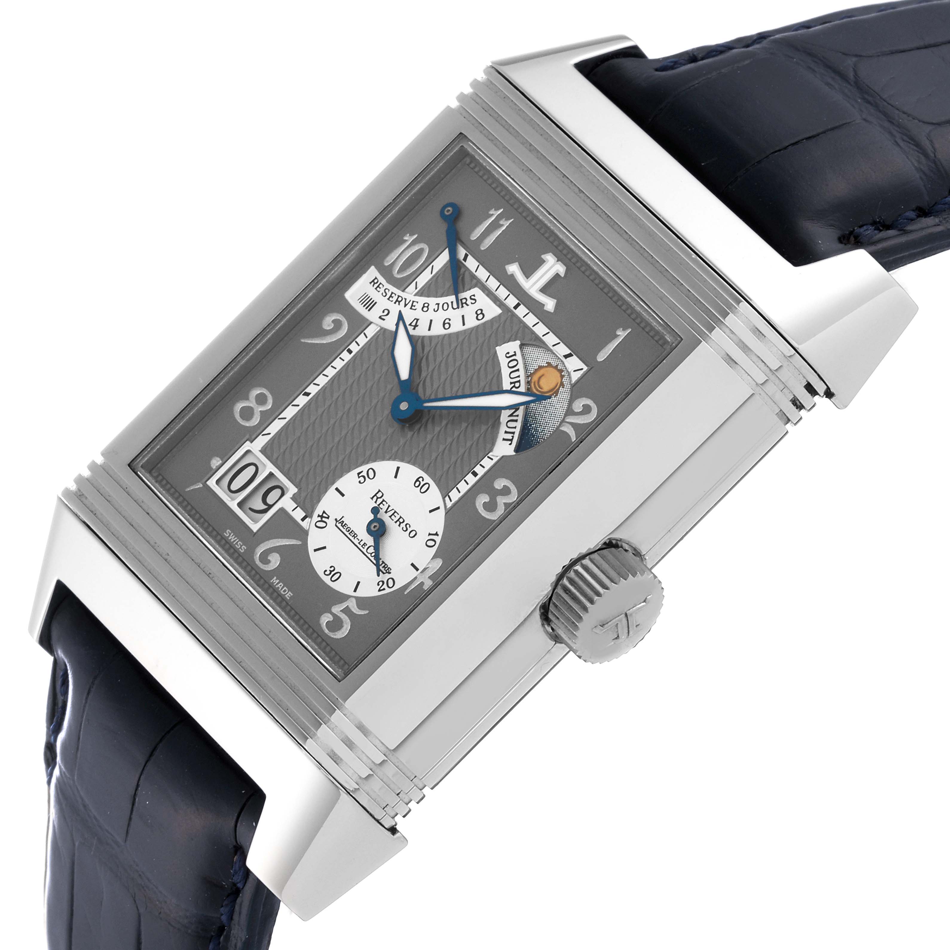 The Jaeger-LeCoultre Reverso watch is shown at an angled view, displaying the dial, side crown, and part of the strap.