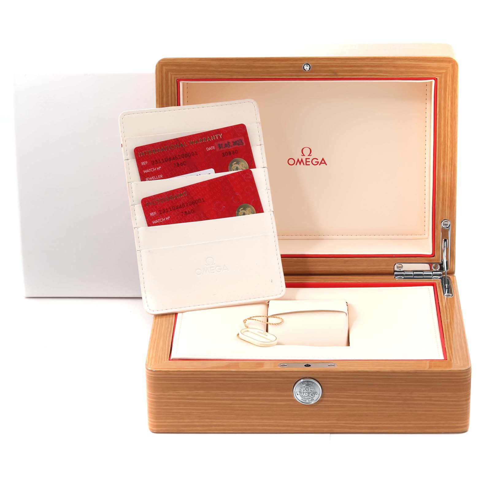 This image shows the interior of the Omega Aqua Terra 231.10.44.52.06.001 Men's Stainless Steel Grey Dial 231.10.44.52.06.001 Men's Stainless Steel Grey Dial watch box with warranty cards and a keychain.