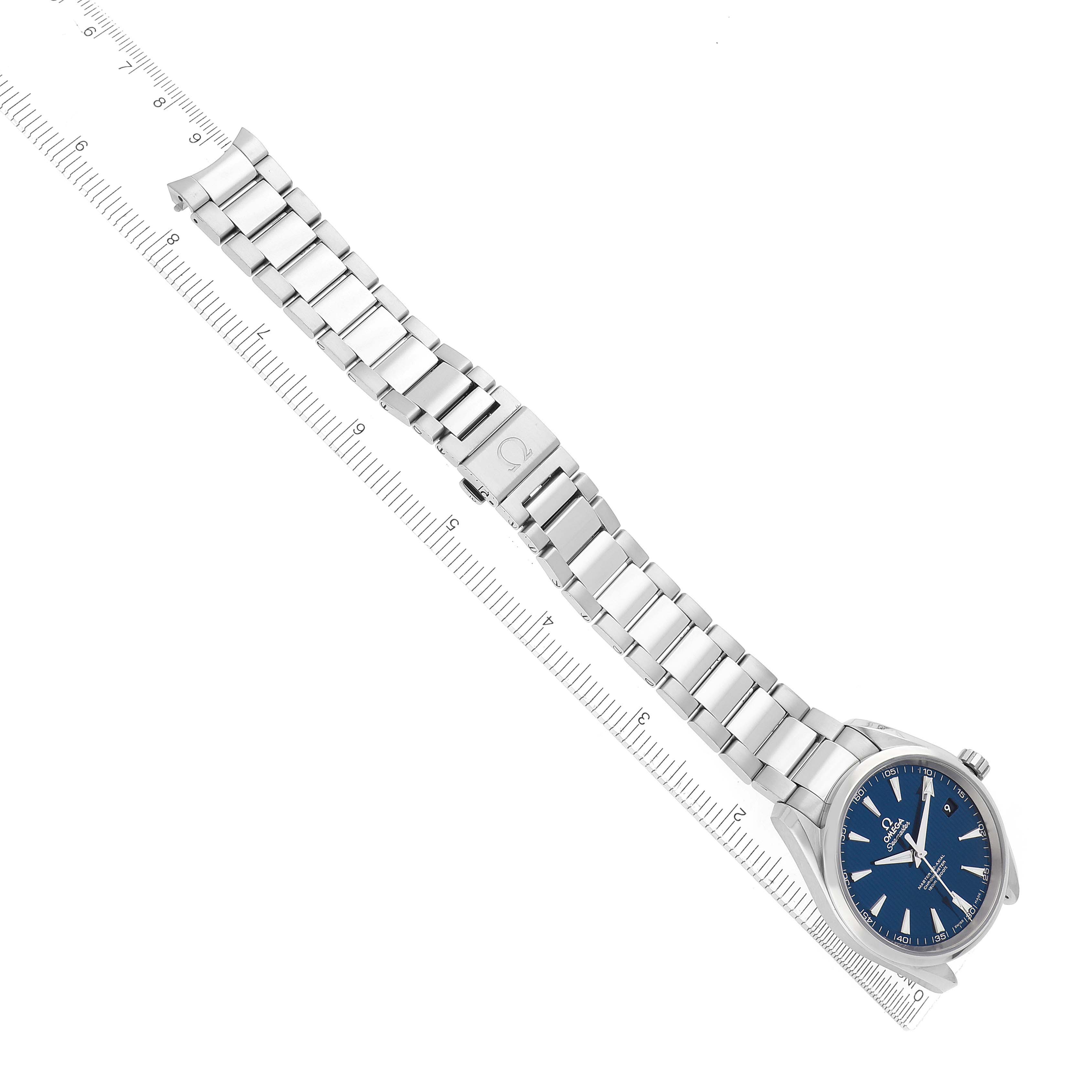 The image shows an Omega Aqua Terra model 231.10.42.21.03.003 men's watch at a diagonal angle, displaying the face, bracelet, and clasp on a ruler.