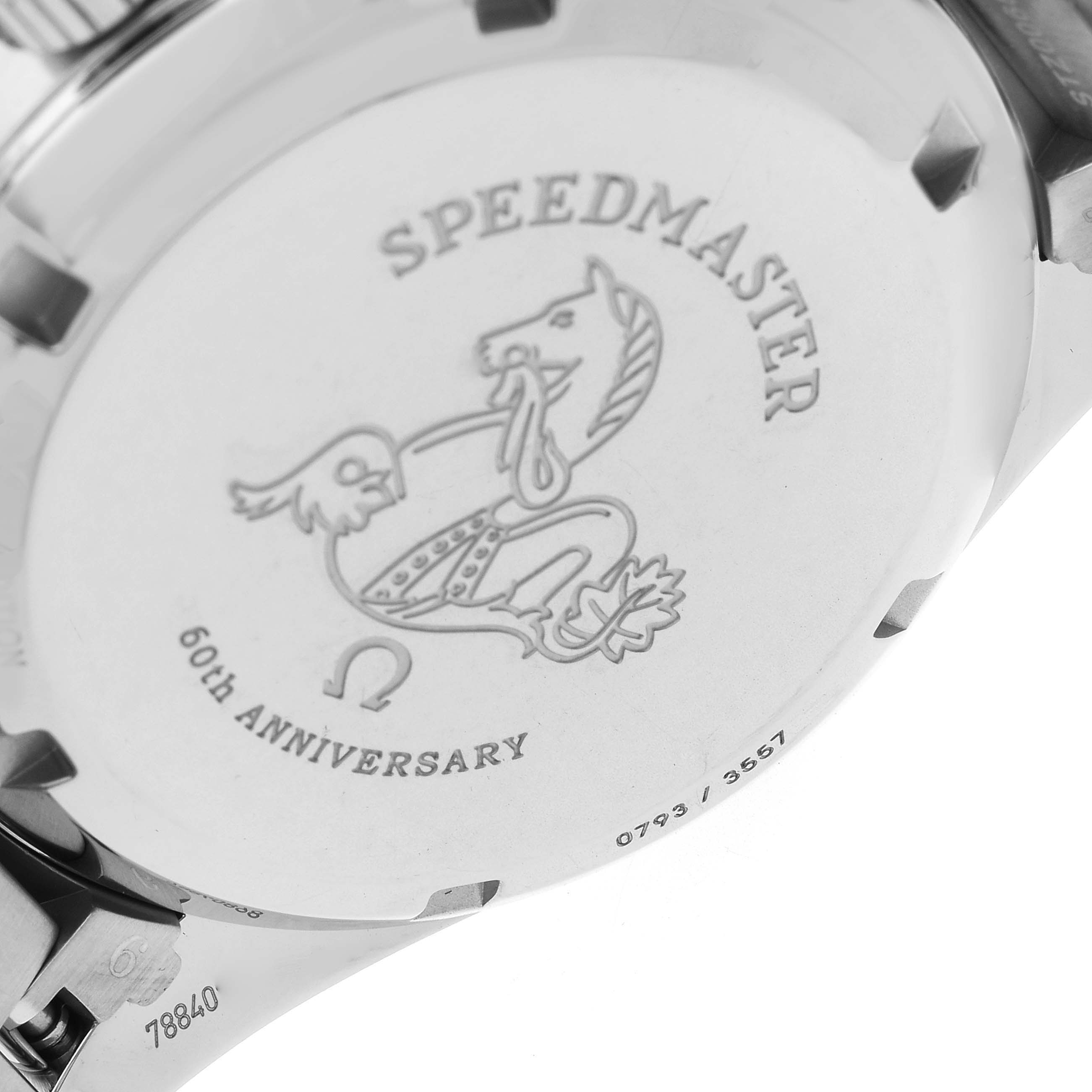 The image shows the case back of the Omega Speedmaster model 311.10.39.30.01.001, highlighting engravings including "SPEEDMASTER," a horse emblem, and "60TH ANNIVERSARY."
