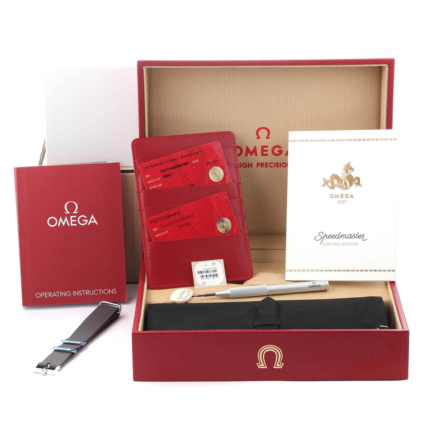 The image shows an Omega Speedmaster 311.10.39.30.01.001 Men's Stainless Steel Black Dial box set with a strap, tool, operating instructions, warranty cards, and a certificate.