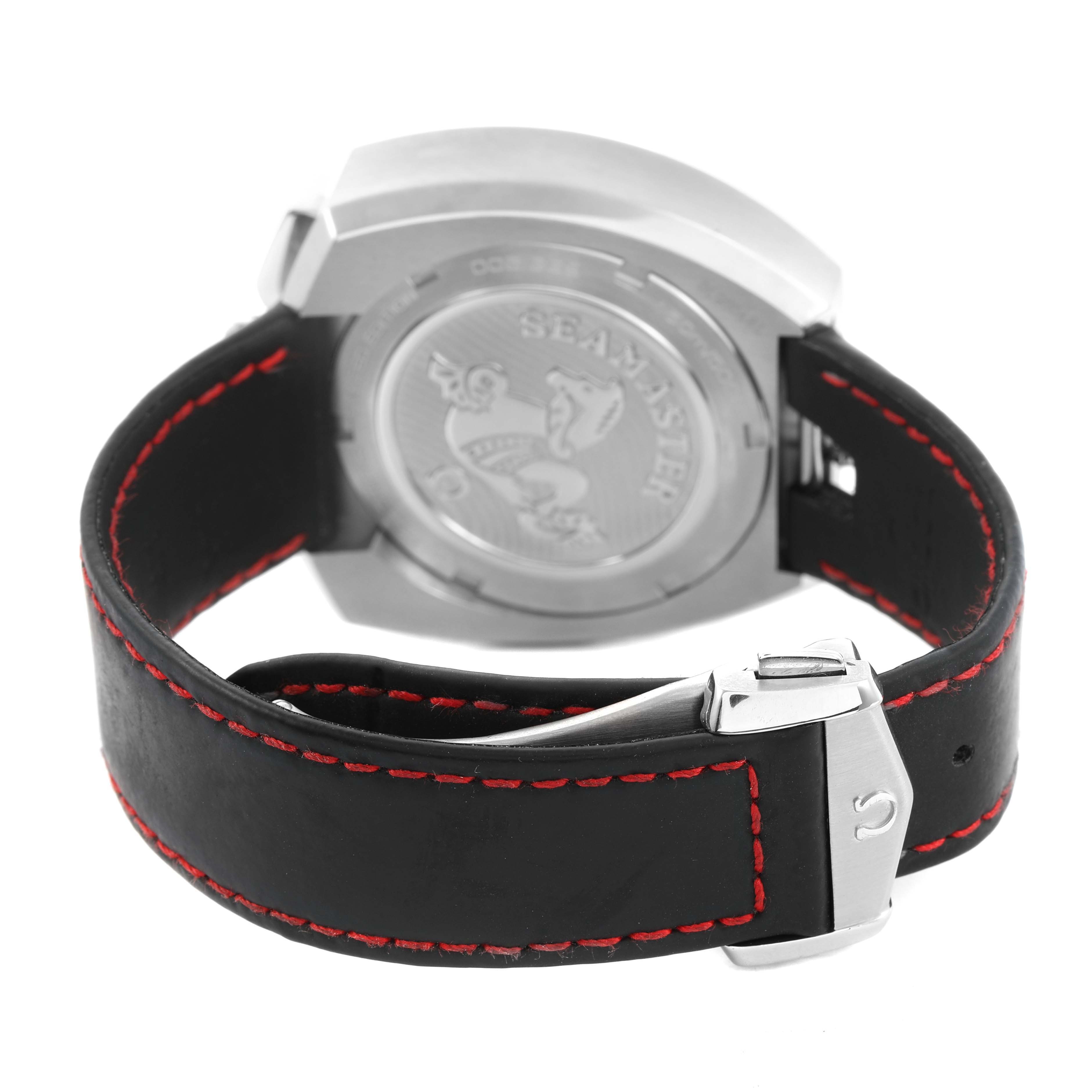 The image shows the back case of an Omega Speedmaster 225.12.43.50.01.001 Men's Stainless Steel Black Dial watch and its leather strap with red stitching and a clasp.
