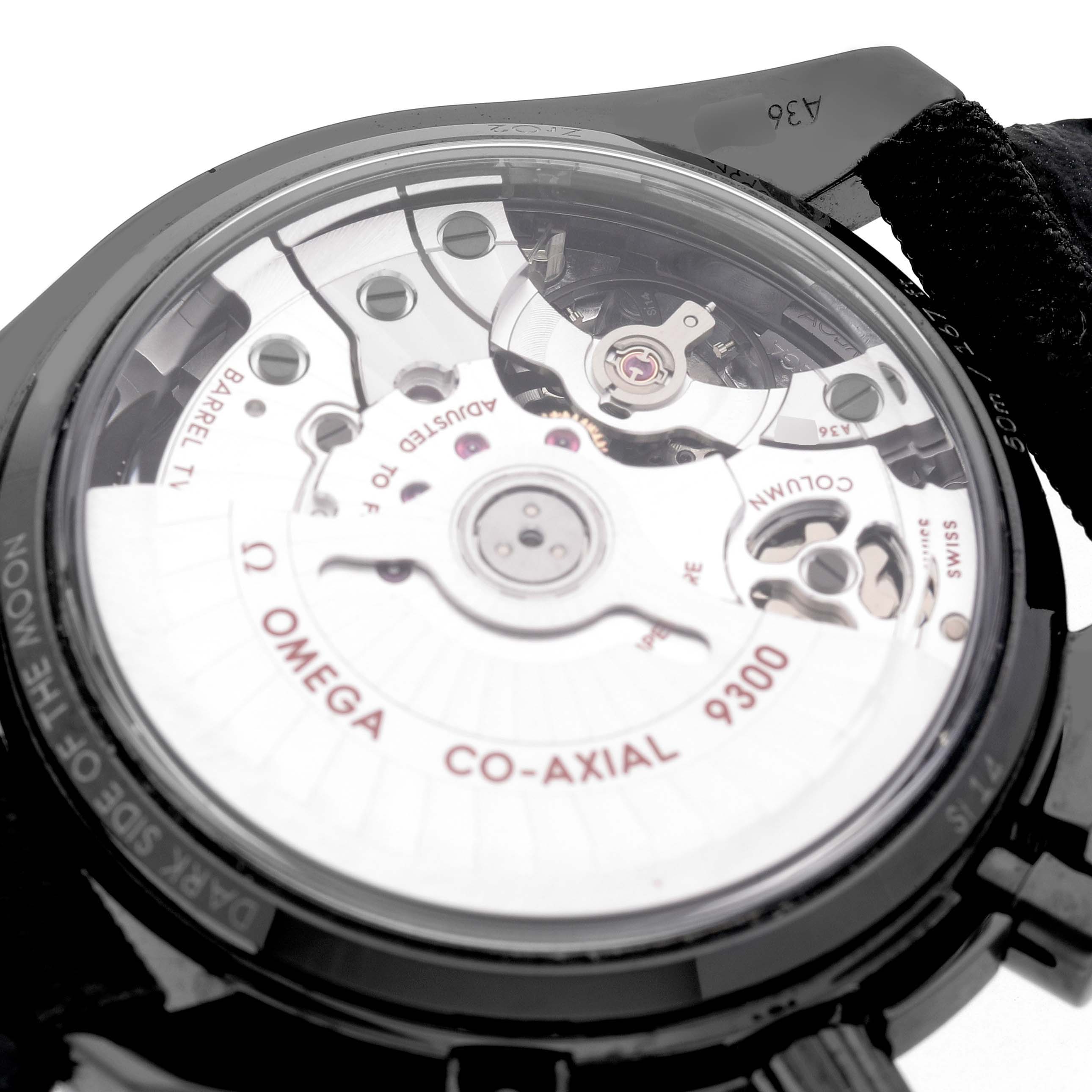 The image shows the back of the Omega Speedmaster 311.92.44.51.01.005 Men's Ceramic Black Dial watch, highlighting its Co-Axial 9300 movement.