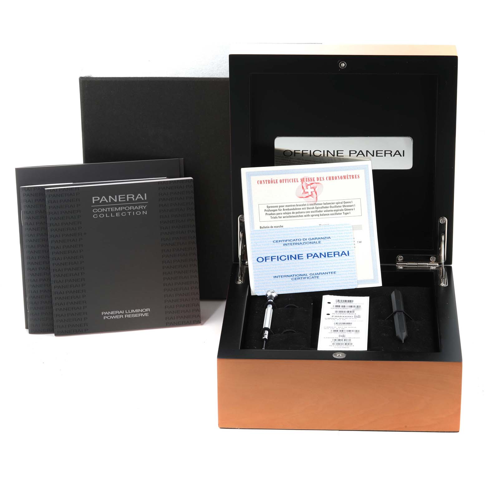 The image shows the packaging, manuals, certificates, and tools of a Panerai Luminor PAM00090 Men
s Stainless Steel Black Dial PAM00090 Men
s Stainless Steel Black Dial watch from a frontal angle.