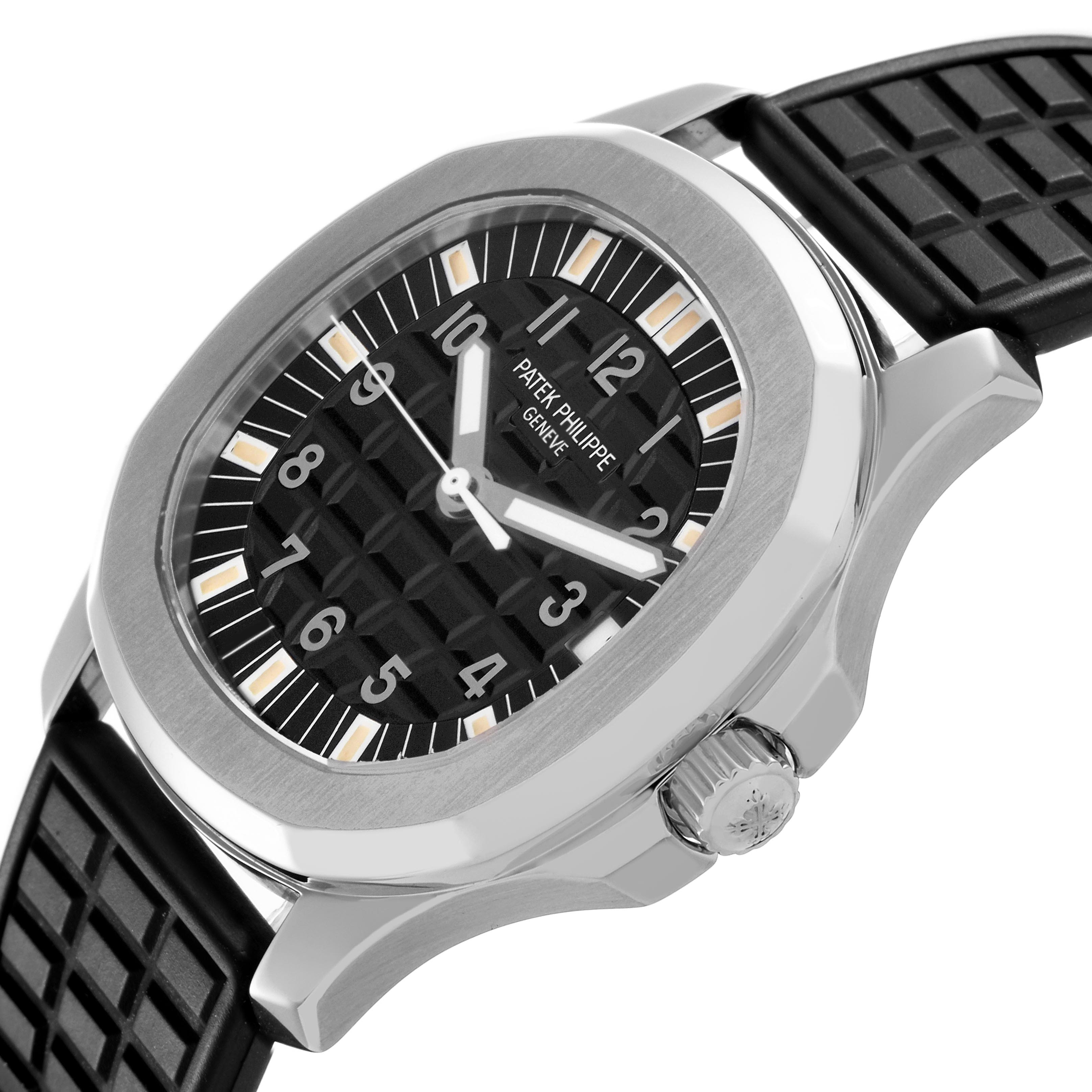 The Patek Philippe Aquanaut 5065/1A-001 is shown at a slight angle, displaying the dial, bezel, crown, and rubber strap.