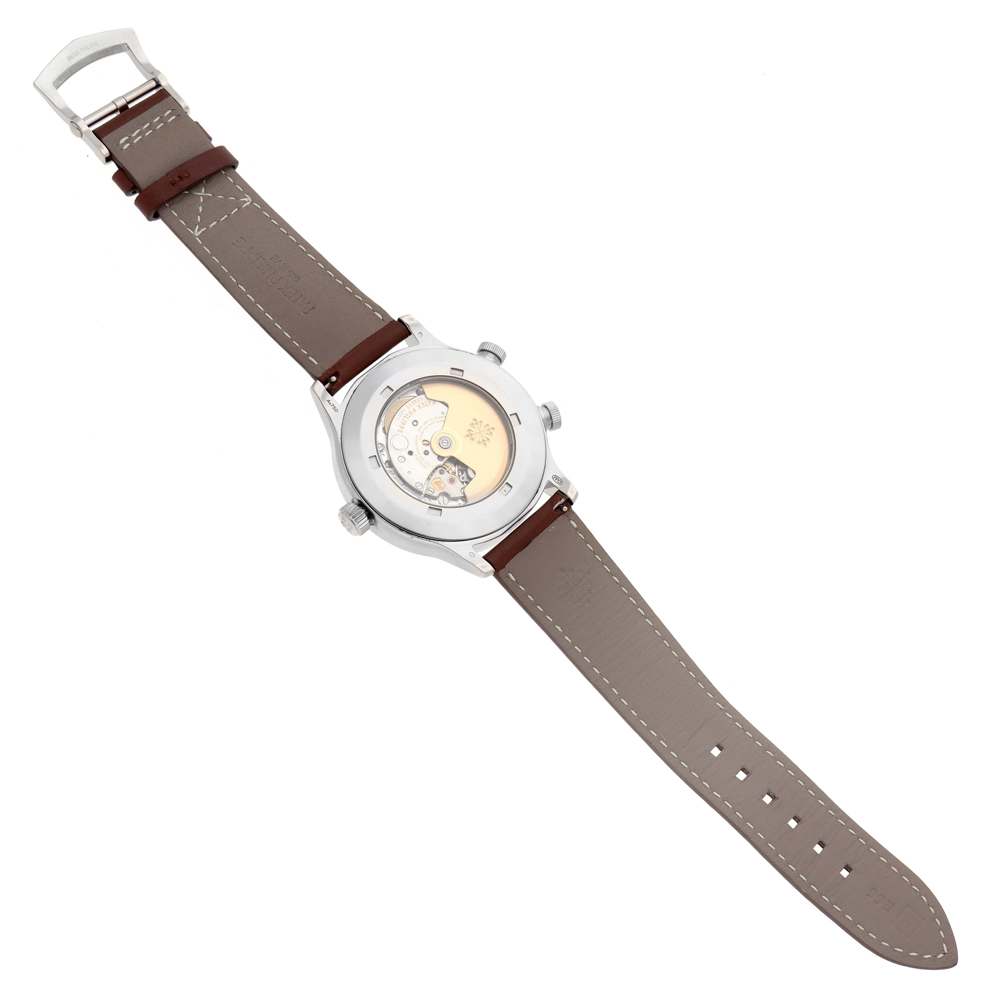 The image shows the back view of a Patek Philippe Calatrava model number 5524G-001, highlighting its visible movement and the leather strap in full view.