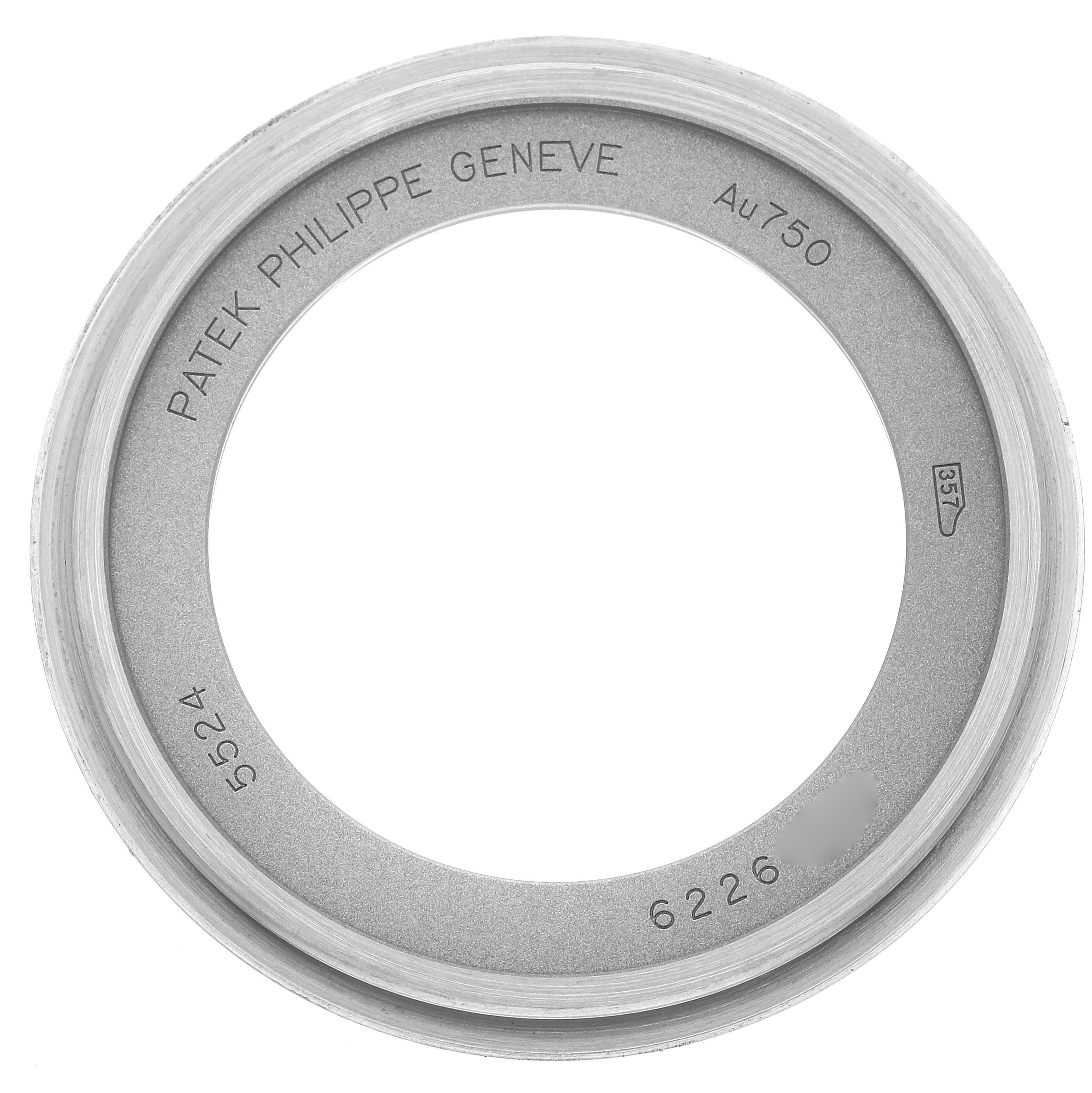 This image shows the bezel of a Patek Philippe Calatrava model 5524G-001, displaying brand engravings and the model number.