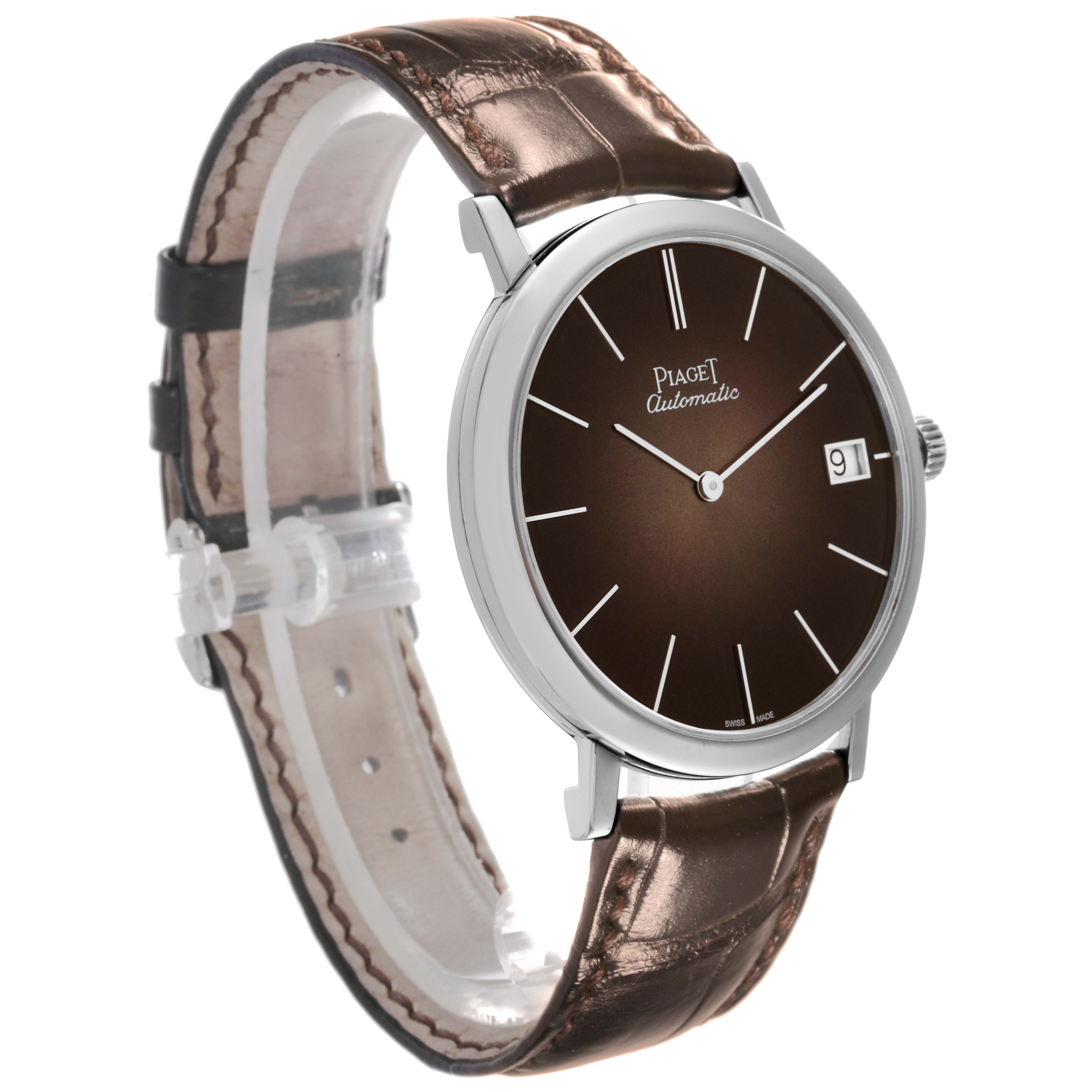 The Piaget G0A42050 Men's White Gold Brown Dial G0A42050 Men's White Gold Brown Dial Altiplano Limited Edition G0A42050 watch is shown at an oblique angle, highlighting the face, bezel, and strap.