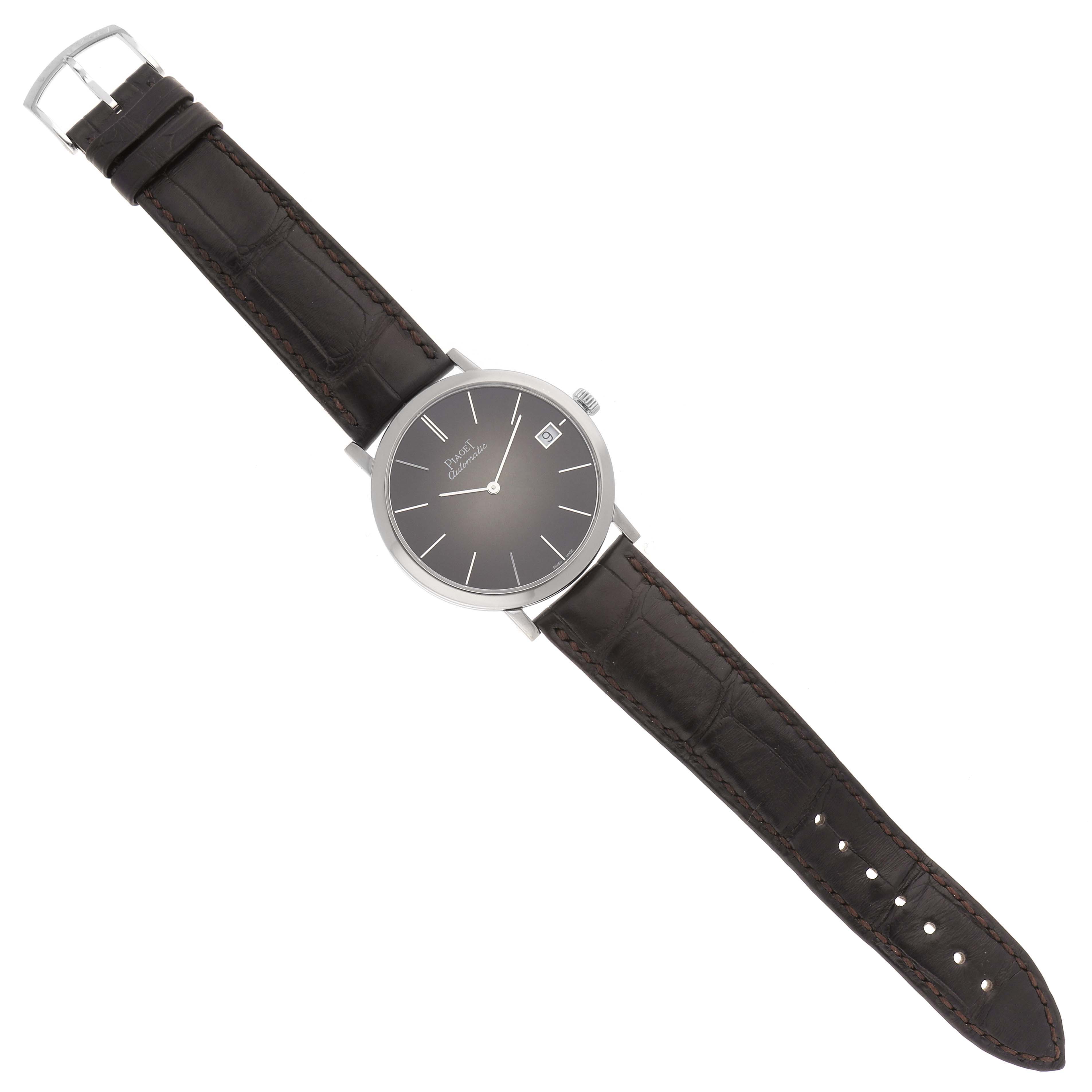 The Piaget G0A42050 Men's White Gold Brown Dial G0A42050 Men's White Gold Brown Dial Altiplano Limited Edition White Gold Ultra Thin Mens Watch G0A42050 is shown in a top-down angle, displaying the watch face and entire leather strap.