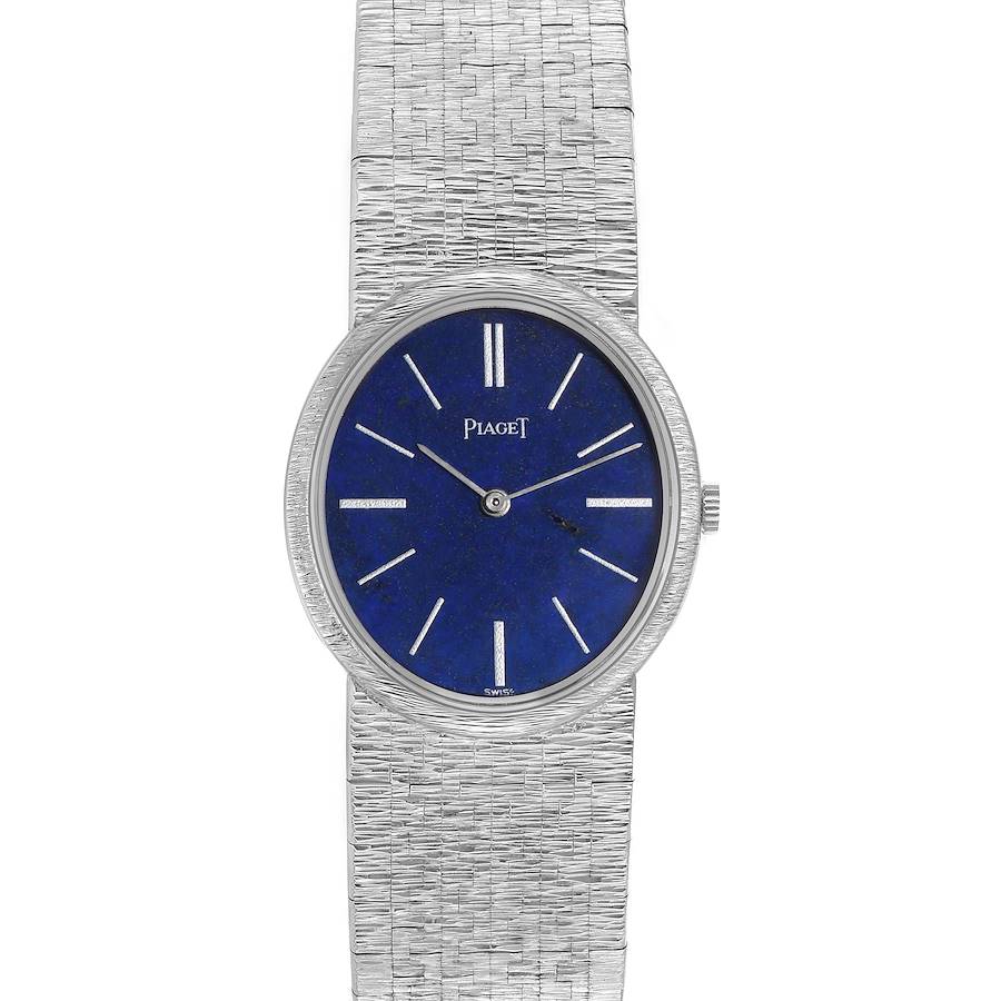 The Piaget watch model 9822A6 is shown from a top-down angle, displaying its blue dial, silver hands, indices, and a textured silver bracelet.