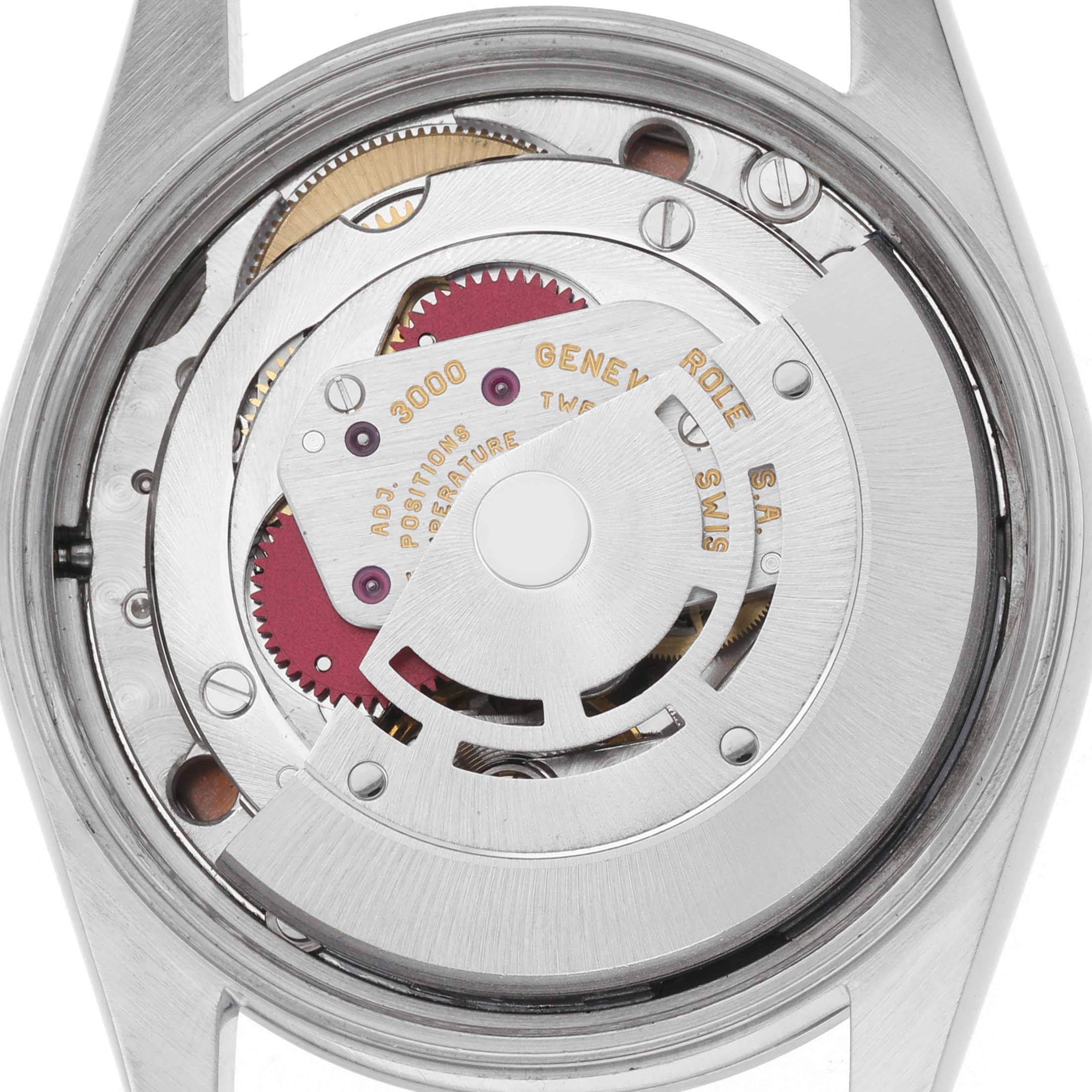 The image shows the movement mechanism of a Rolex Air-King model, model number 14000, viewed from the back with visible gears and the rotor.