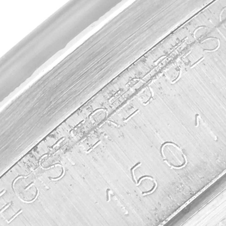 The image shows a close-up view of the engraved casing on a Rolex Date 1501 Men
s Stainless Steel Grey Dial 1501 Men
s Stainless Steel Grey Dial model watch.