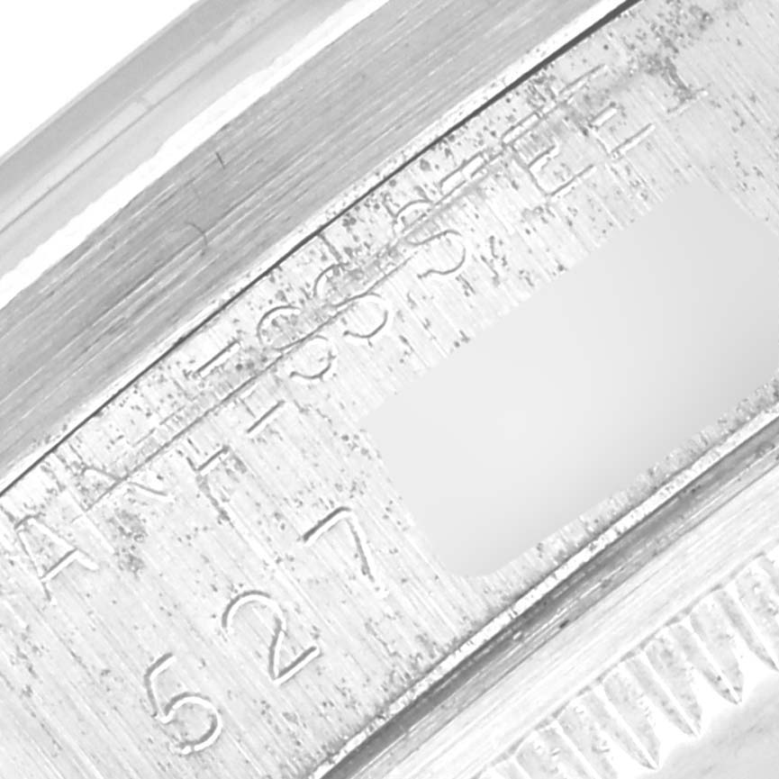 This close-up image shows a detailed view of the inner bezel engraving on a Rolex Date 1501 Men
s Stainless Steel Grey Dial 1501 Men
s Stainless Steel Grey Dial model watch.