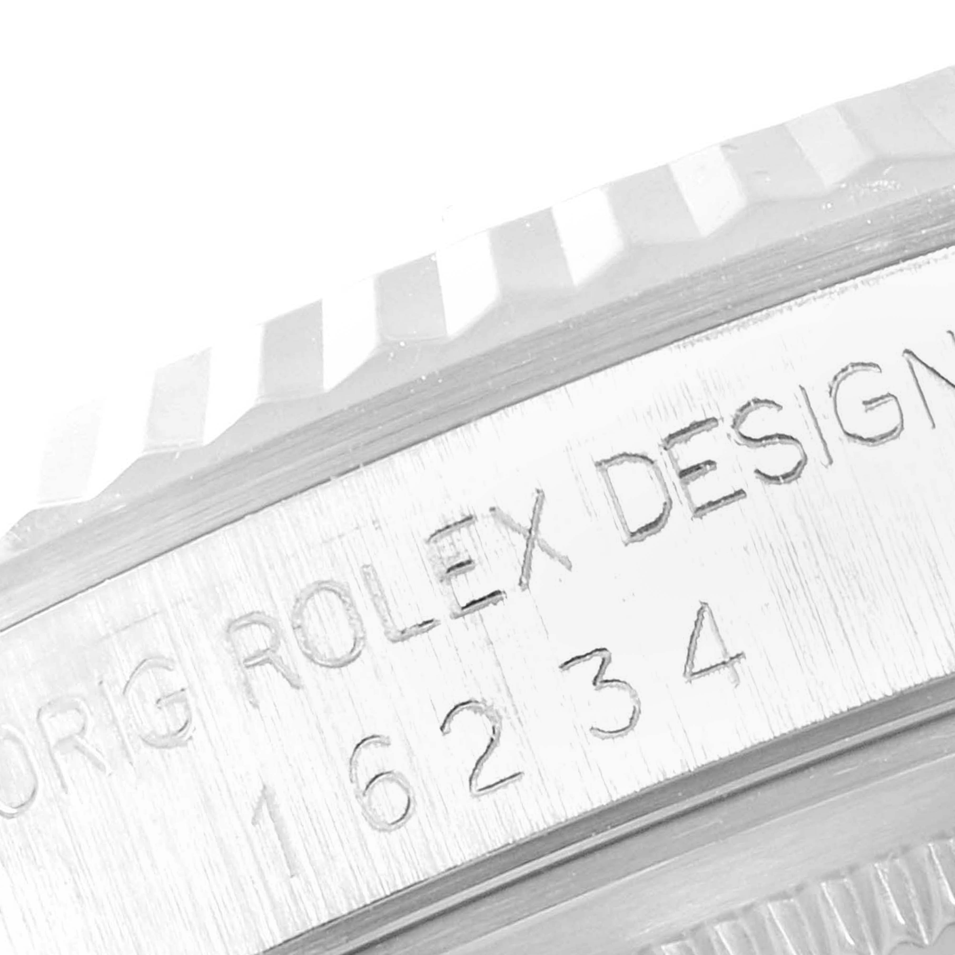 This close-up image shows the engraved model number and part of the bezel of a Rolex Datejust 16234 Men's Stainless Steel Silver Dial 16234 Men's Stainless Steel Silver Dial watch.