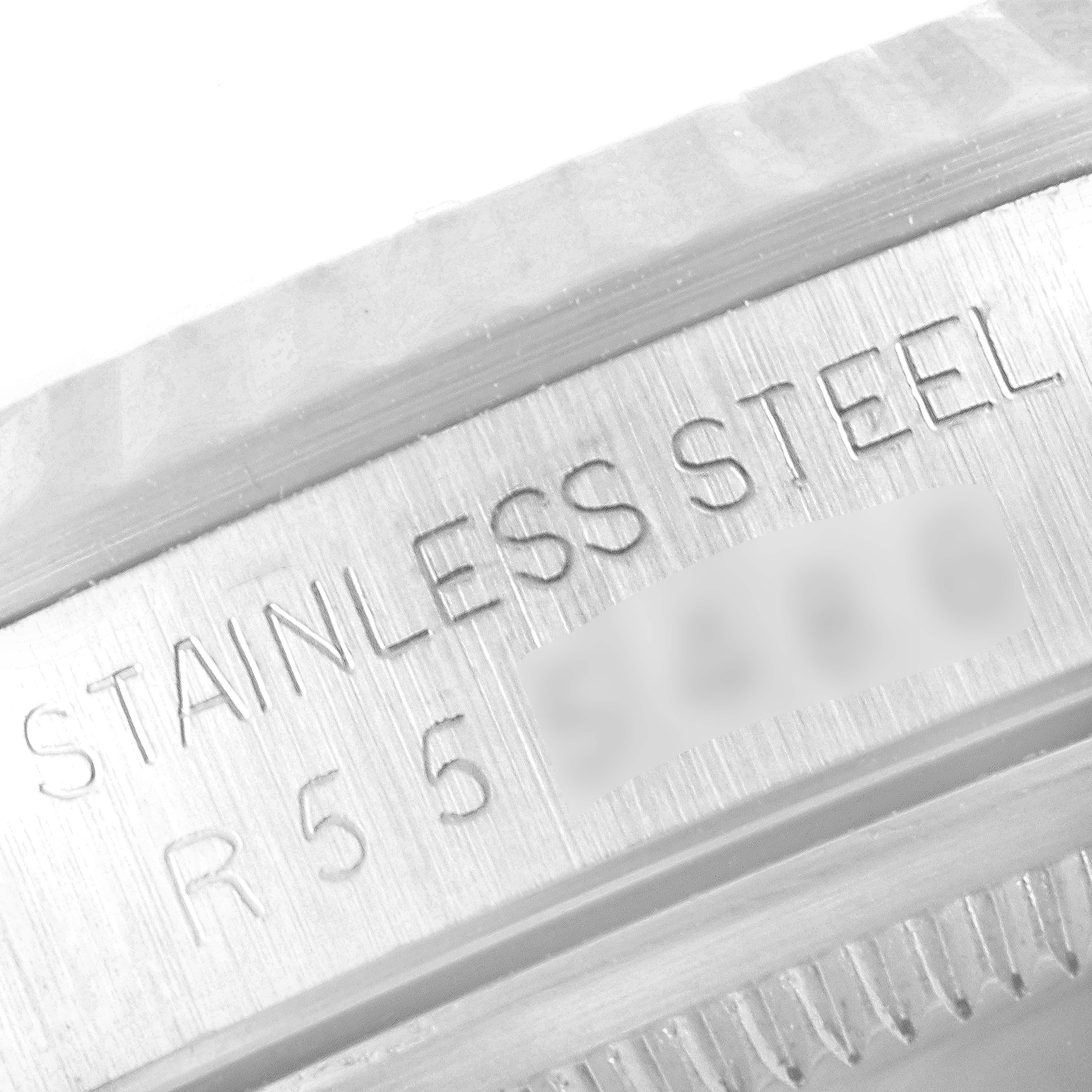 This image shows the engraved stainless steel marking and part of the fluted bezel on a Rolex Datejust 16234 Men's Stainless Steel Silver Dial 16234 Men's Stainless Steel Silver Dial watch.